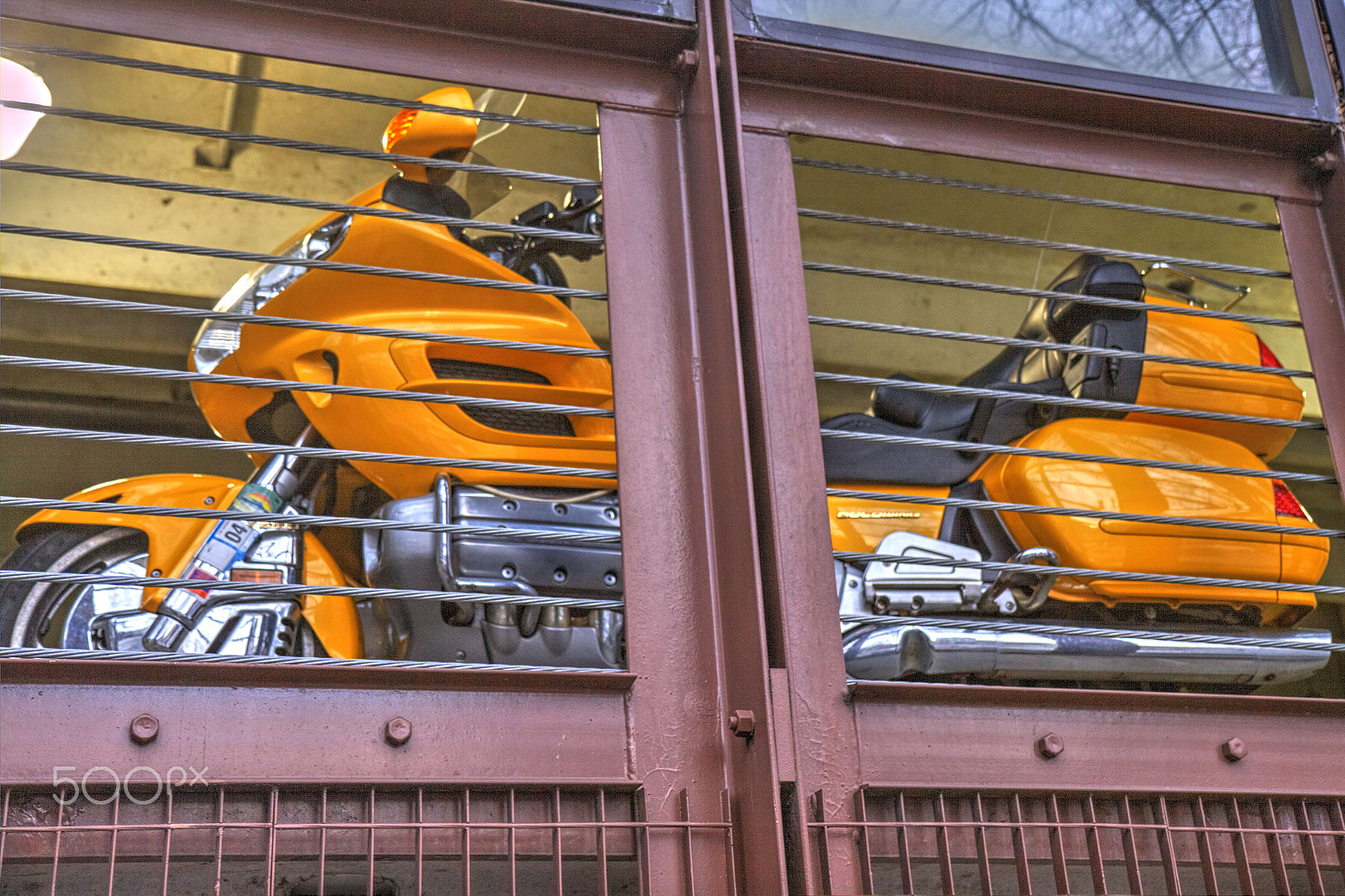 Canon EF-S 17-55mm F2.8 IS USM sample photo. Secured motorcycle photography