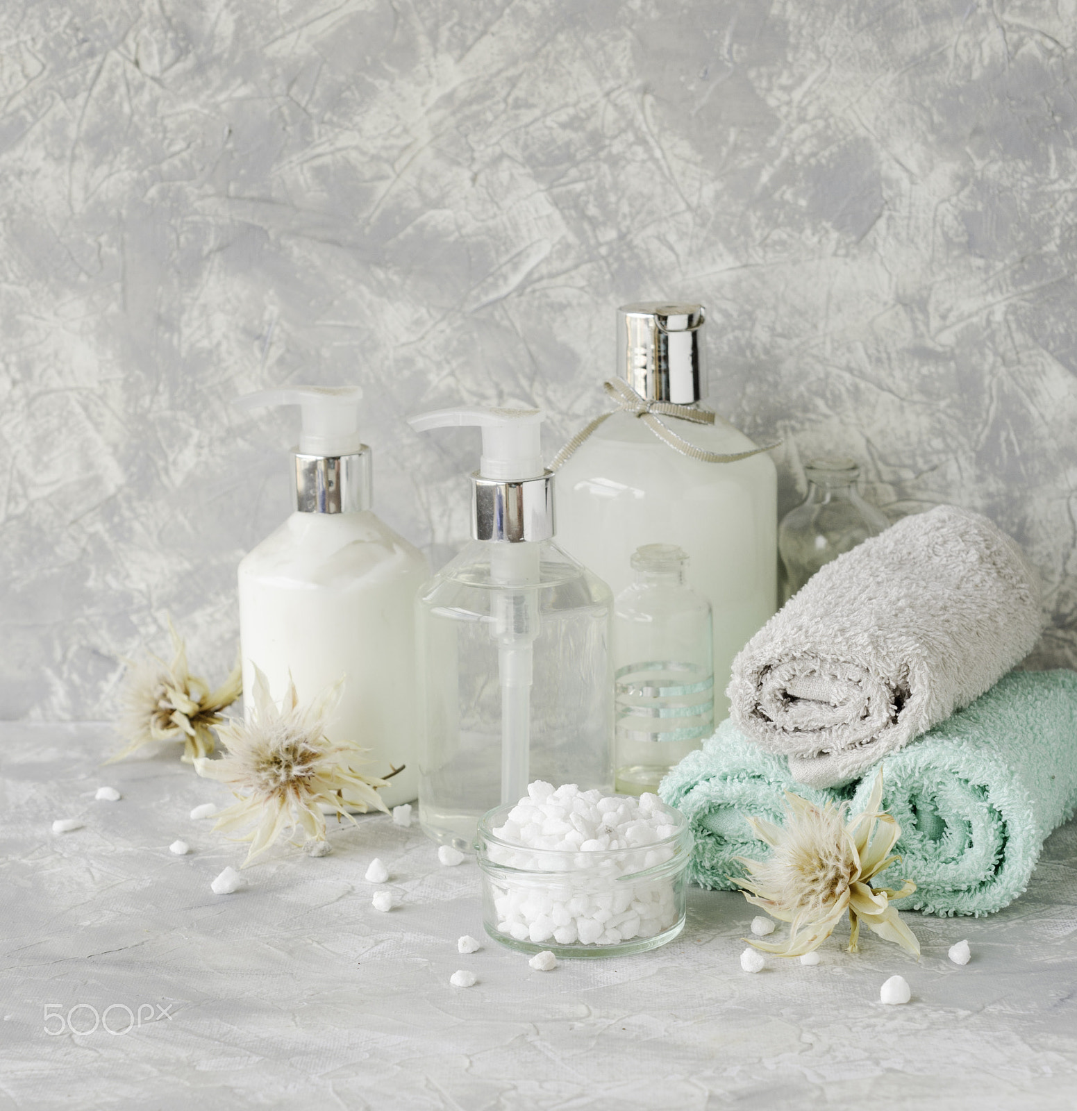 Nikon AF-S DX Micro Nikkor 40mm F2.8 sample photo. Spa set on a white marble table with a stack of towels, selective focus photography