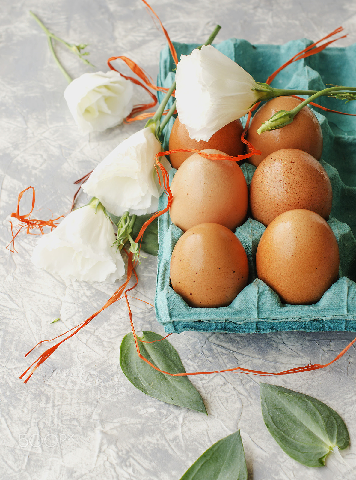 Nikon AF-S DX Micro Nikkor 40mm F2.8 sample photo. Raw eggs in a carton for eggs with white flowers on a marble white table, ready for painting... photography