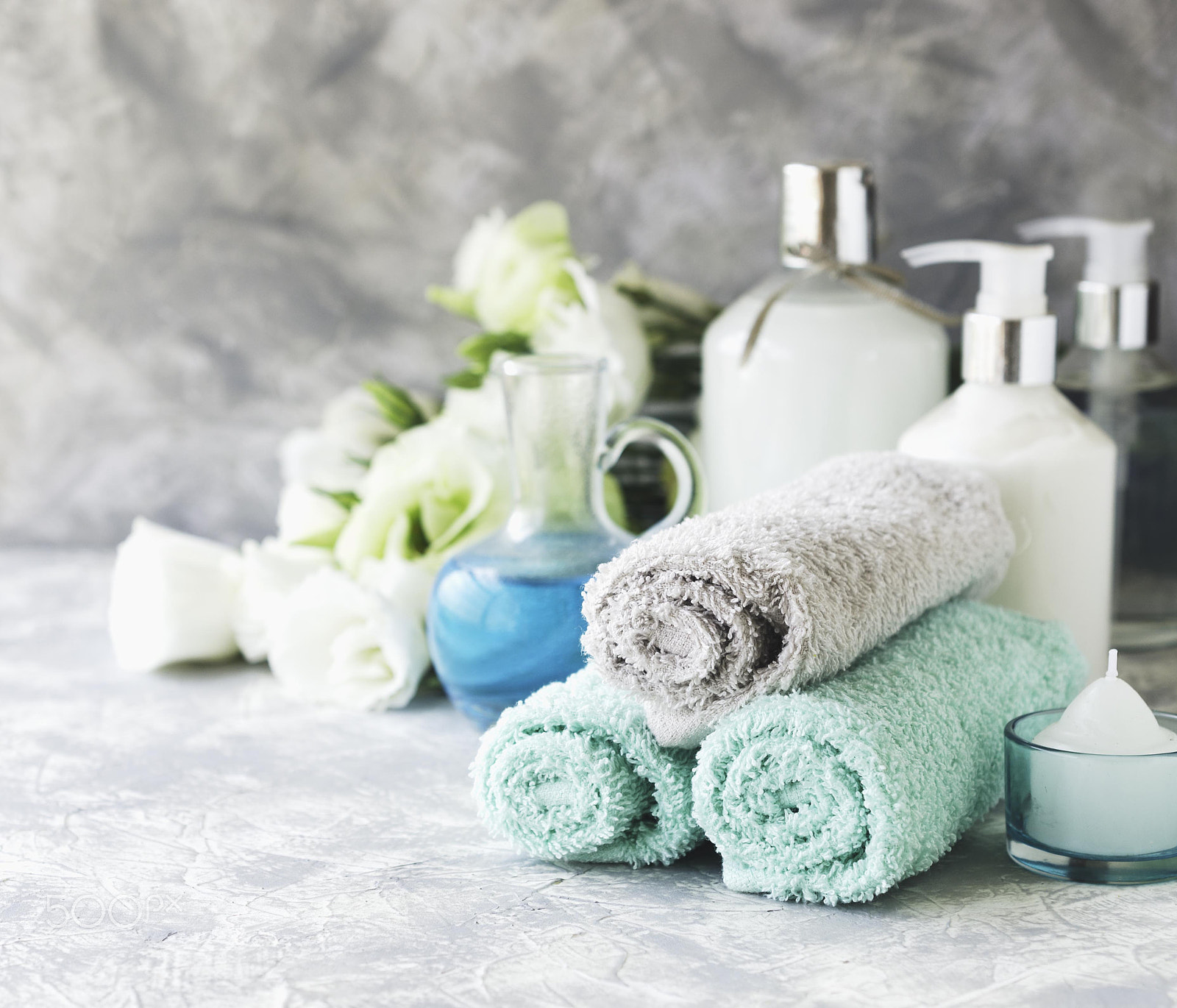 Nikon AF-S DX Micro Nikkor 40mm F2.8 sample photo. Spa set on a white marble table with a stack of towels, selective focus photography