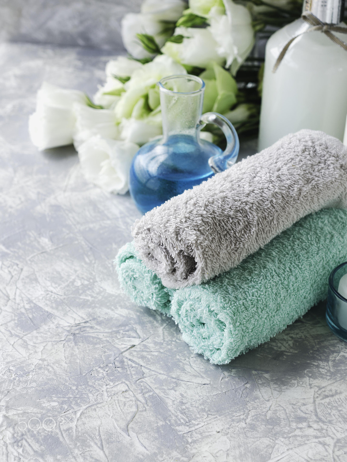 Nikon AF-S DX Micro Nikkor 40mm F2.8 sample photo. Spa set on a white marble table with a stack of towels, selective focus photography