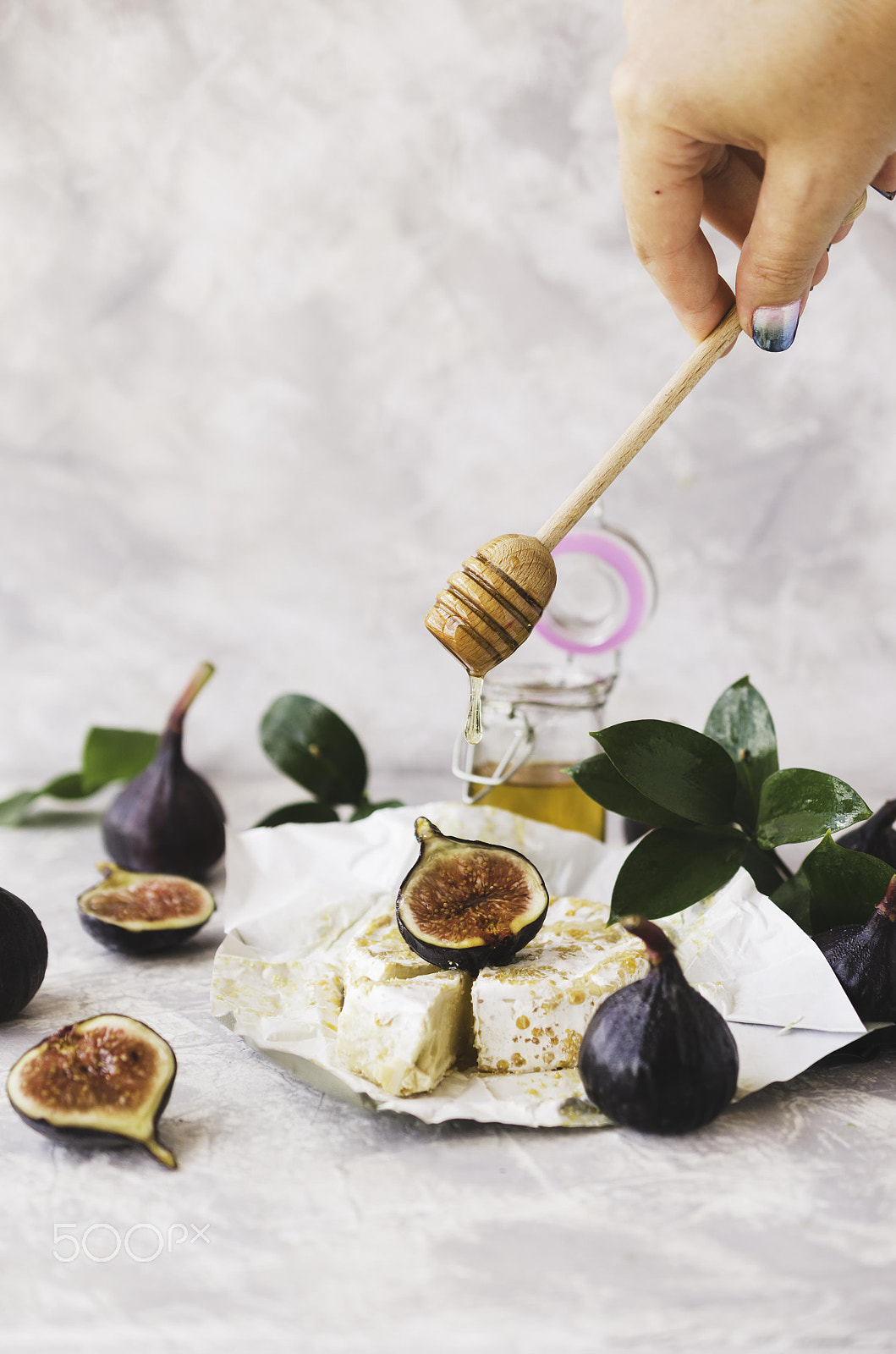 Nikon AF-S DX Micro Nikkor 40mm F2.8 sample photo. Blu cheese, figs and honey on a white marble table, selective focus photography