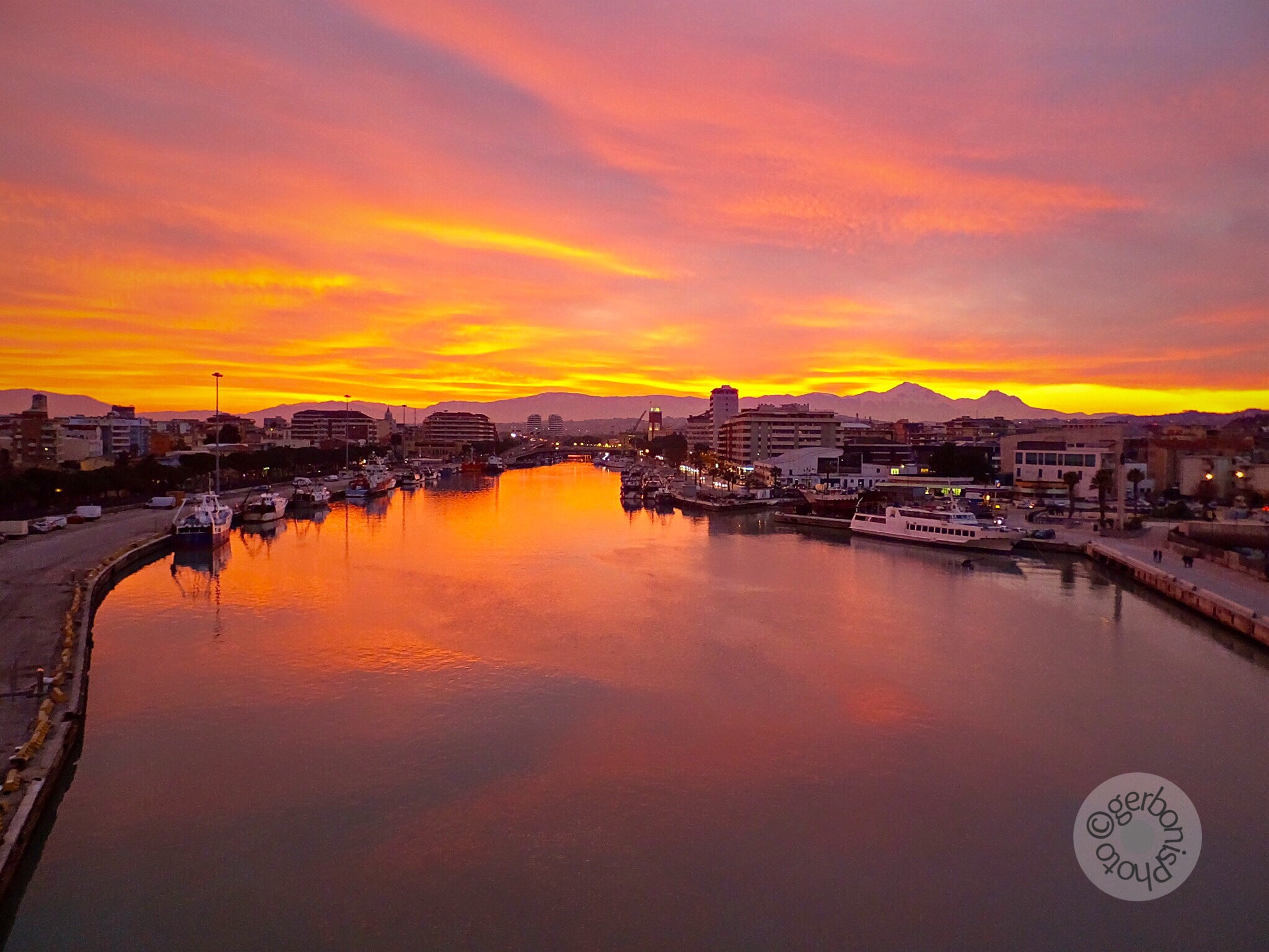 Fujifilm FinePix F900EXR sample photo. Fiery sunset between sea and mountains  photography