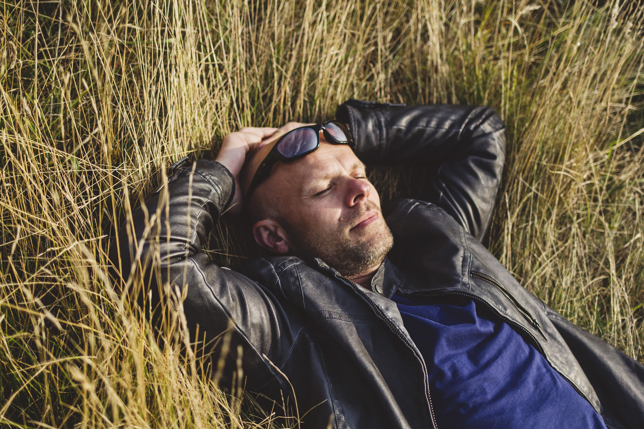 Canon EF 35mm F2 IS USM sample photo. Man in a field photography