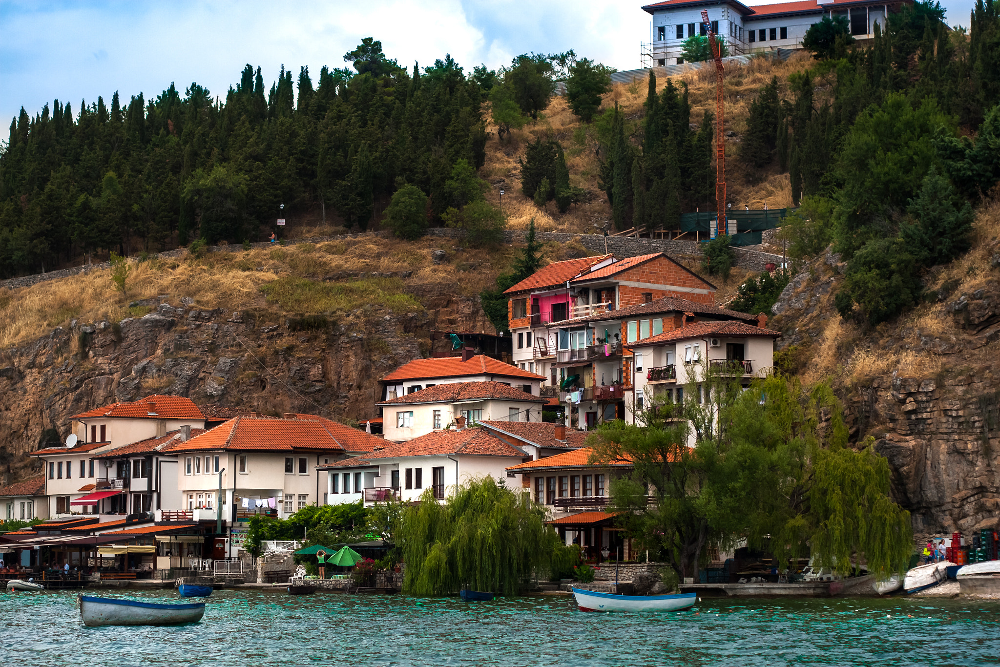Canon EOS 30D + Canon EF 50mm f/1.8 sample photo. Buildings with orange roofs on the shore of lake ohrid photography