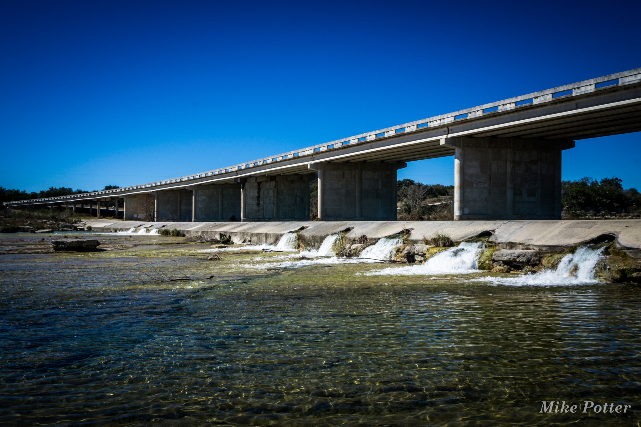 Sony a6000 + Sony E 18-55mm F3.5-5.6 OSS sample photo. Neuces river bridge, texas photography