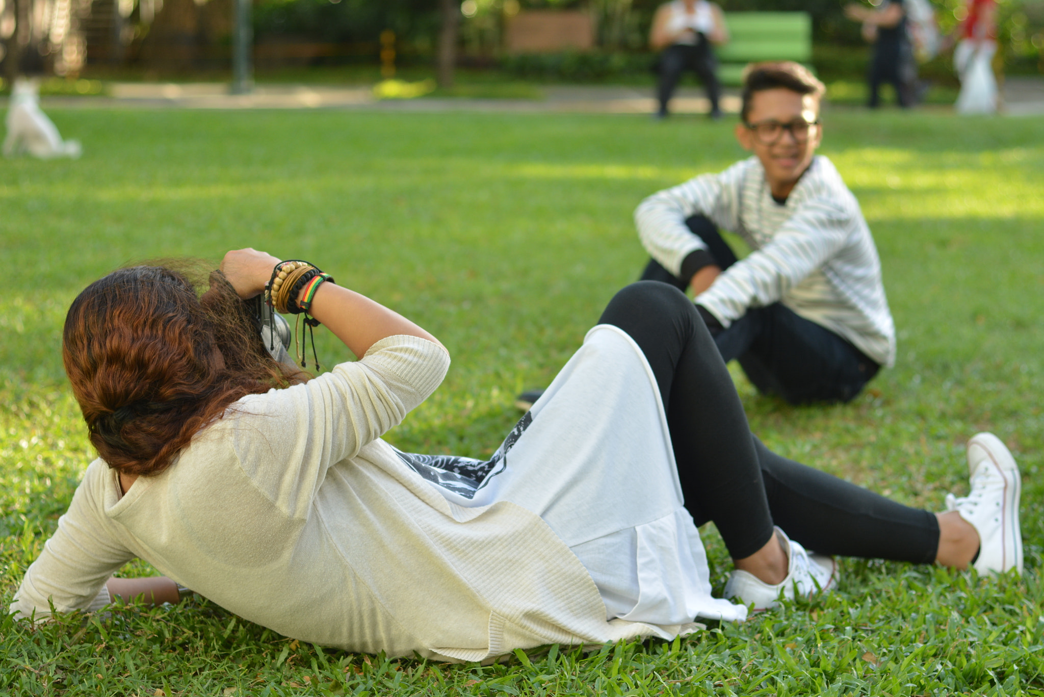 Nikon D5200 + Nikon AF Nikkor 50mm F1.8D sample photo. Woman photographer in action photography