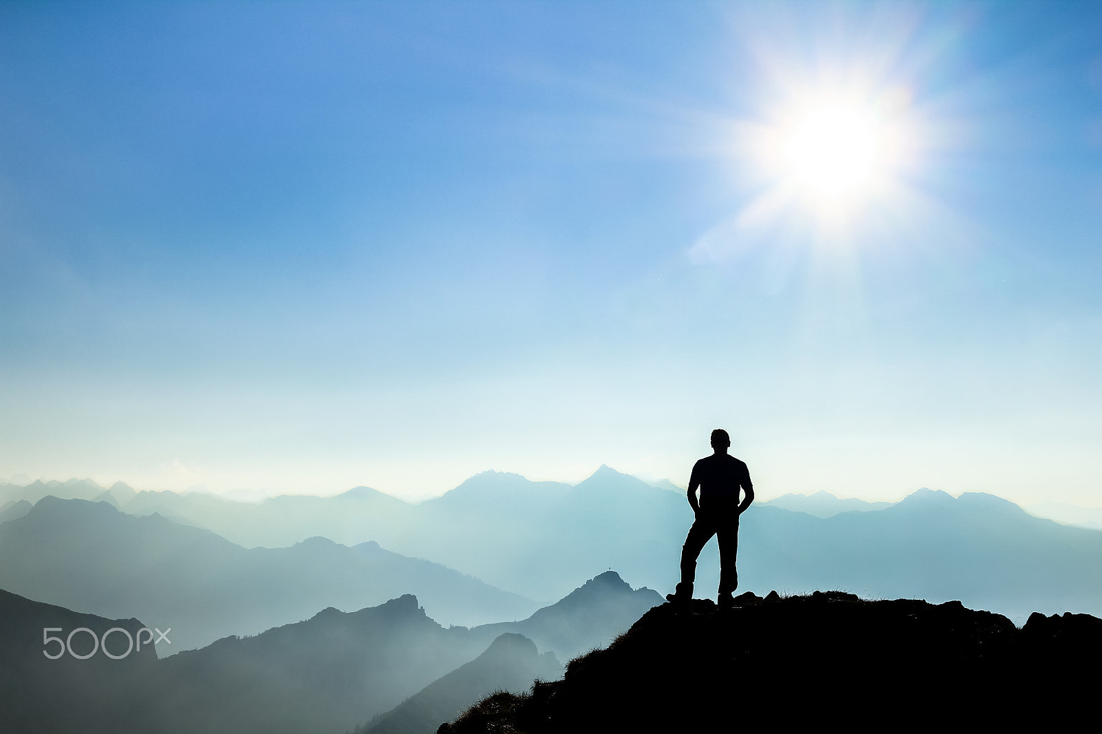 Canon EOS 550D (EOS Rebel T2i / EOS Kiss X4) sample photo. Man reaching summit enjoying freedom and watching towards mountain ranges. photography