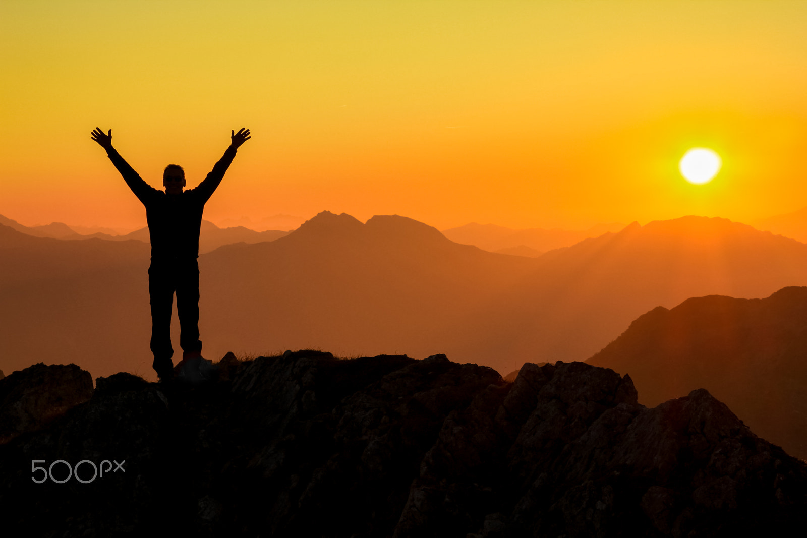 Canon EOS 550D (EOS Rebel T2i / EOS Kiss X4) sample photo. Happy success winning man arms up on mountain at sunset photography