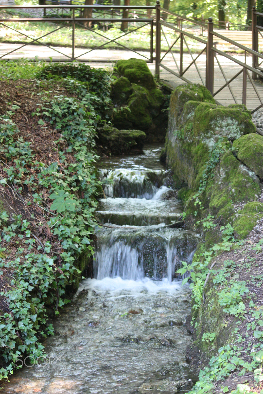 Canon EF-S 55-250mm F4-5.6 IS sample photo. Waterfall in a garden photography