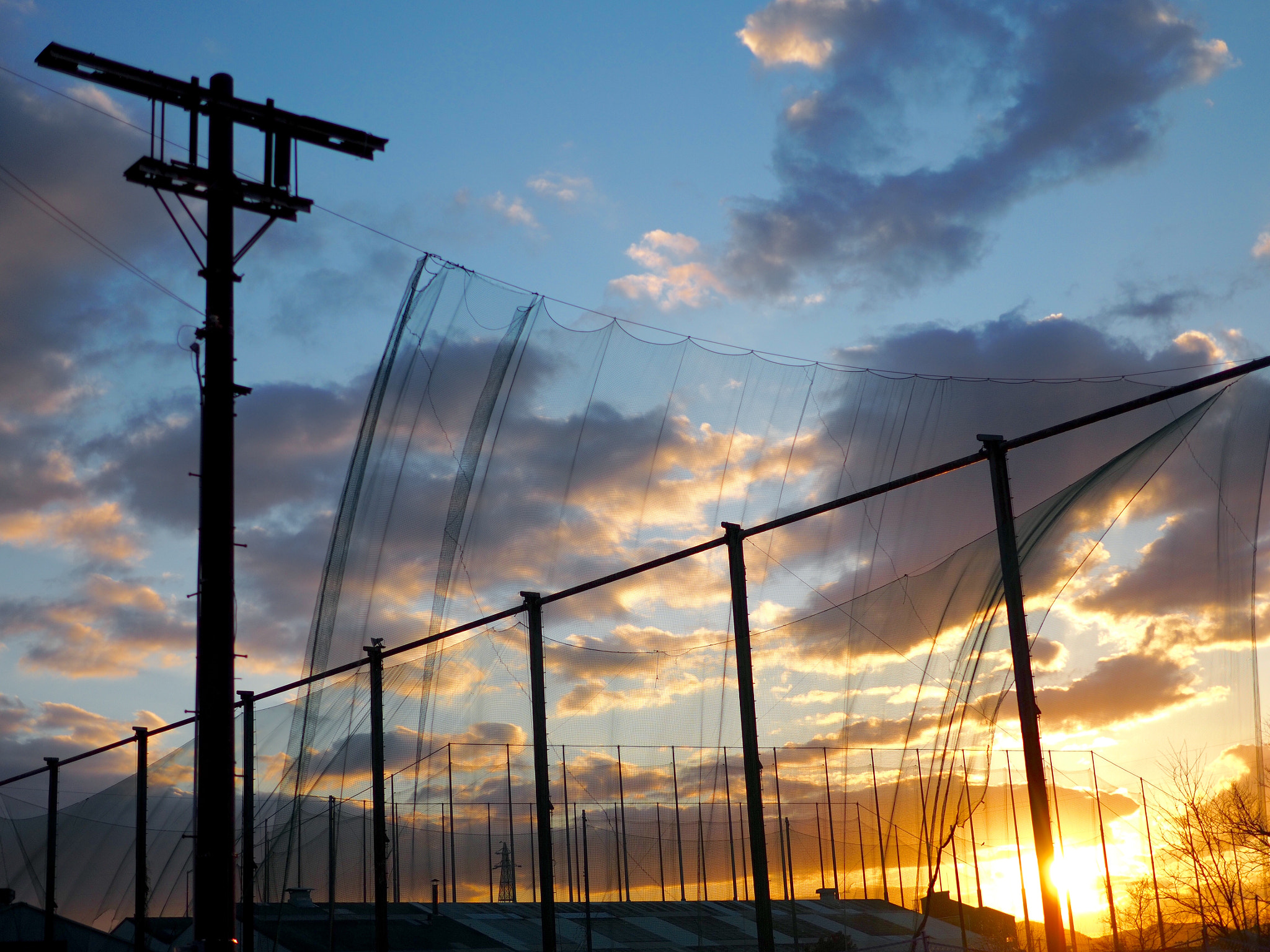 Olympus OM-D E-M5 II sample photo. Sunset at the driving range photography