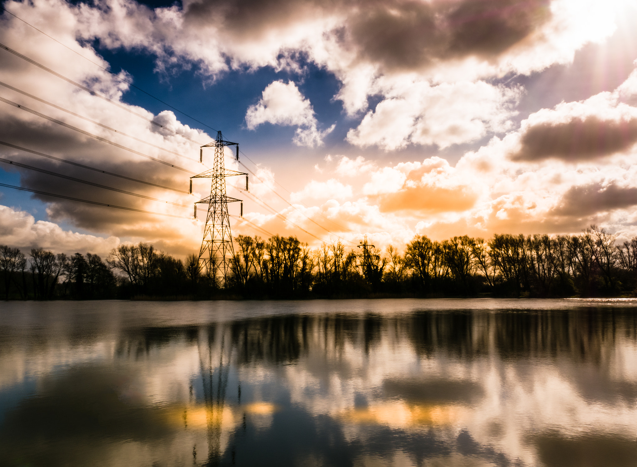 Panasonic Lumix G X Vario 12-35mm F2.8 ASPH Power OIS sample photo. Lake powerline tower photography