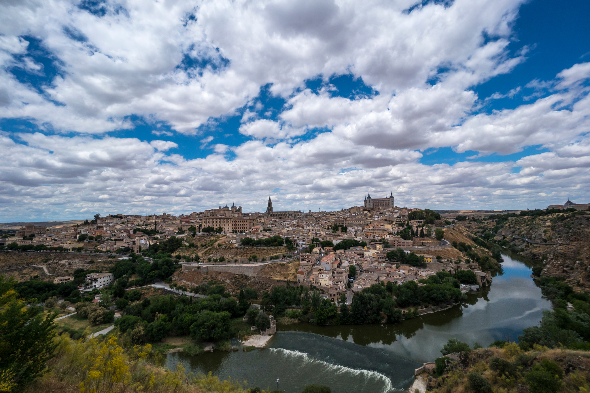 Sony a7R II + Sony E 10-18mm F4 OSS sample photo. Clouds over toledo photography