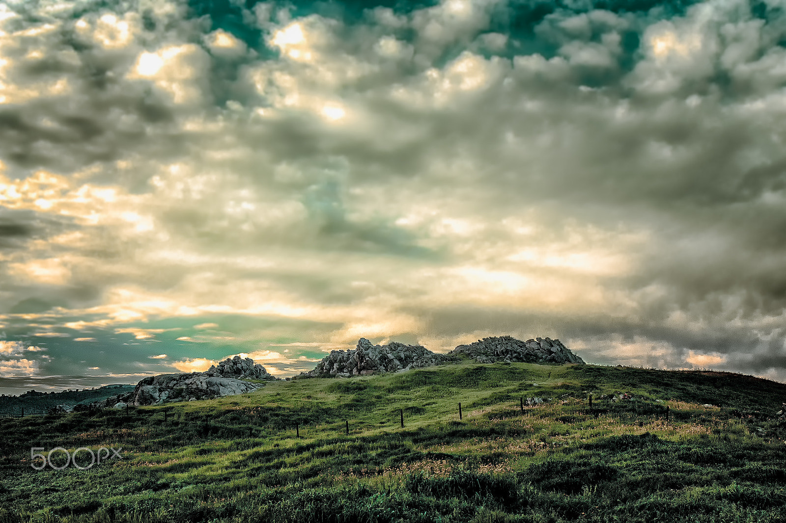 Sigma 30mm F1.4 EX DC HSM sample photo. Rocky terrain among a lush green landscape photography