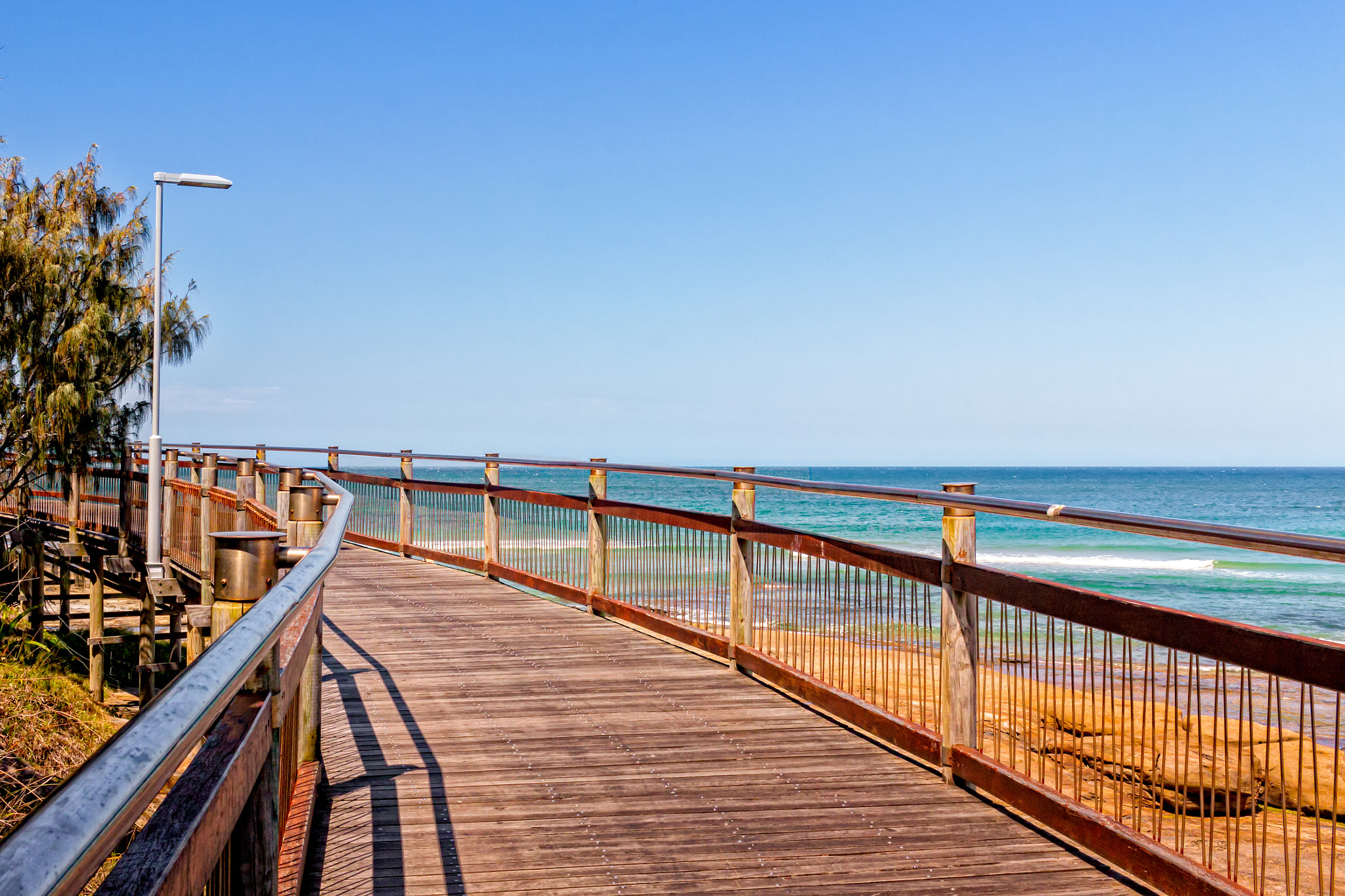 Canon EF-S 24mm F2.8 STM sample photo. Boardwalk by the sea photography