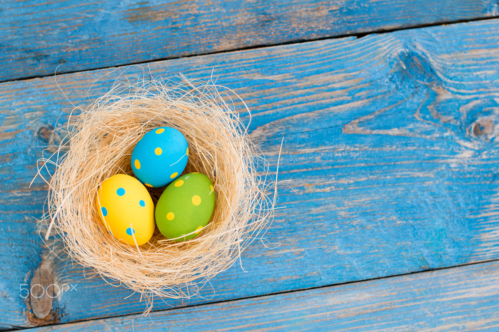 Nikon D800 sample photo. Easter eggs on a blue wooden background photography