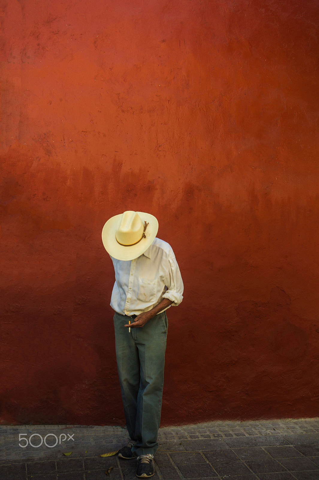 Leica M9 + Summicron-M 35mm f/2 (IV) sample photo. Human hat smoking a cigarette photography