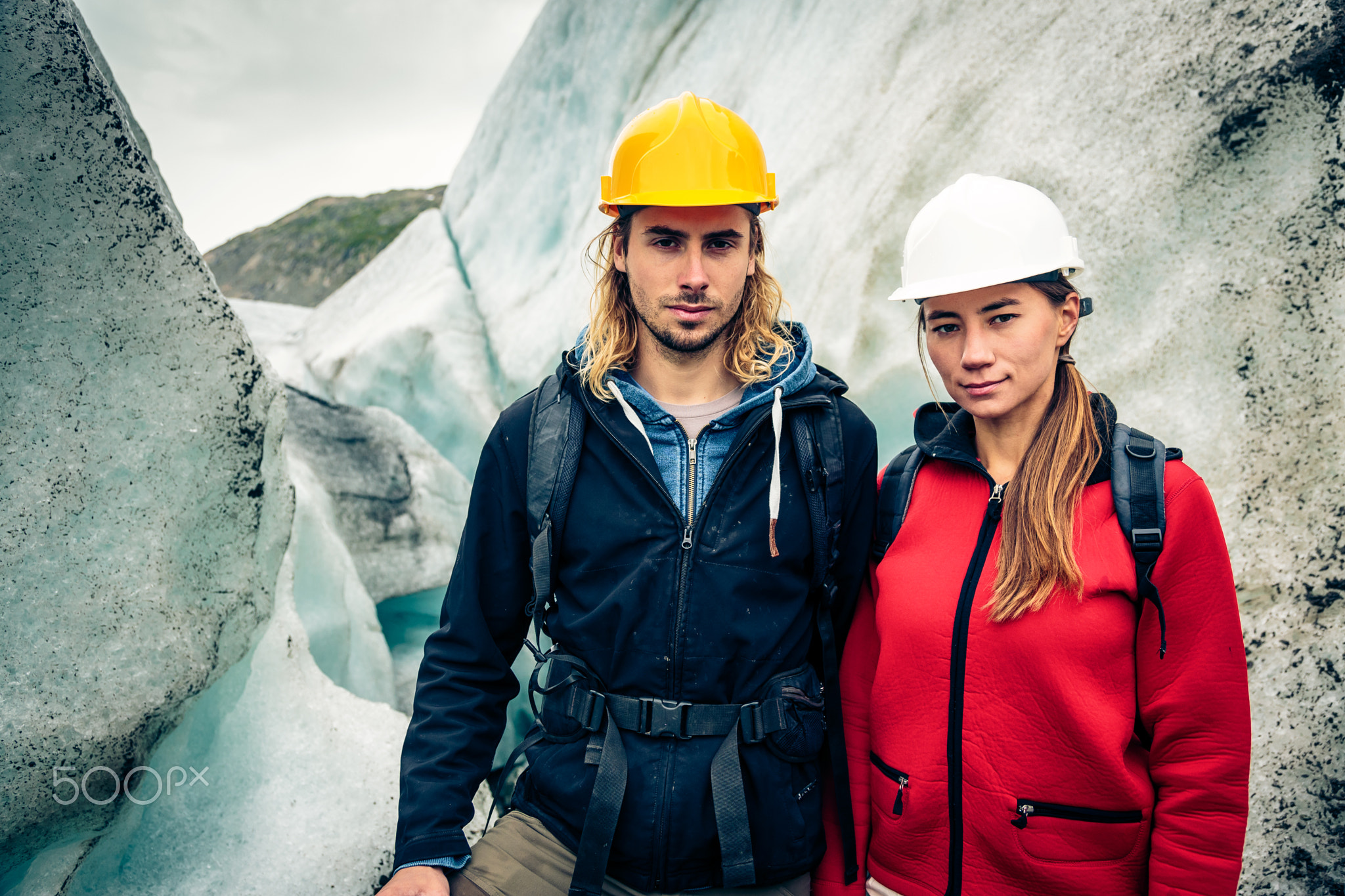 Team Of Scientists Examining A Glacier