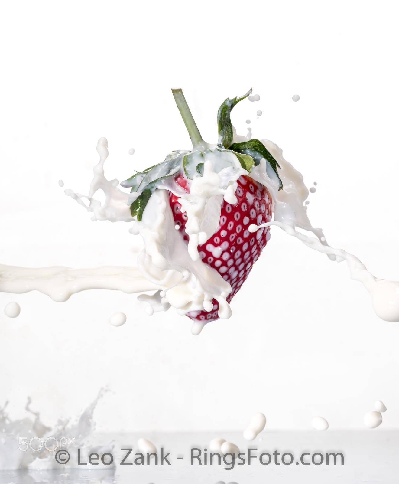 Fujifilm X-T2 sample photo. Strawberry in milk splash photography