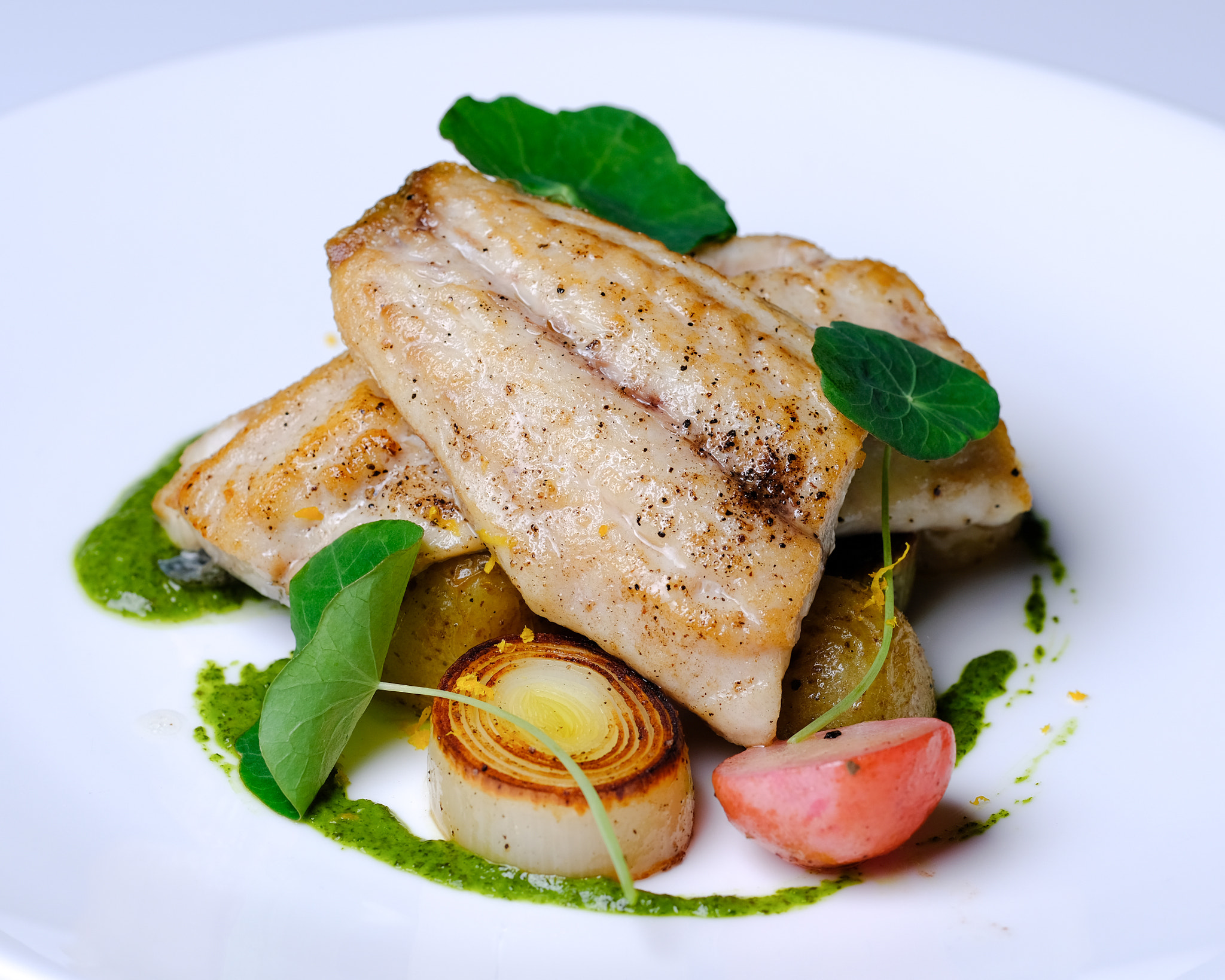 Fujifilm X-Pro2 + Fujifilm XF 90mm F2 R LM WR sample photo. Pan seared striped bass, nasturtium pesto photography