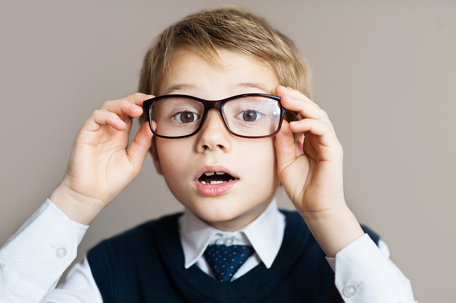 Nikon D700 + Nikon AF Nikkor 85mm F1.8D sample photo. Portrait of schoolboy with glasses on grey background photography