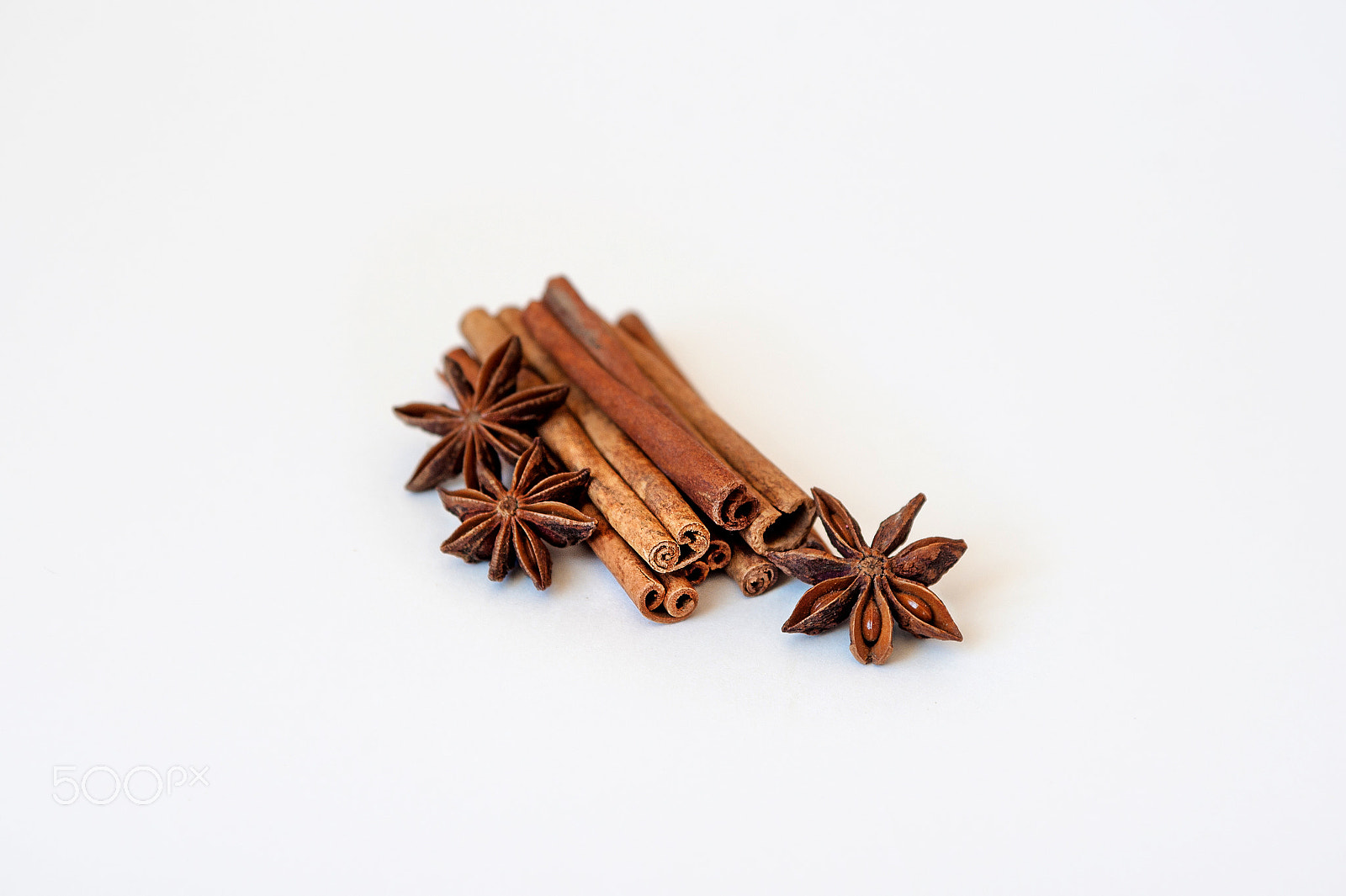 Nikon D700 sample photo. Cinnamon and star anise on white background photography