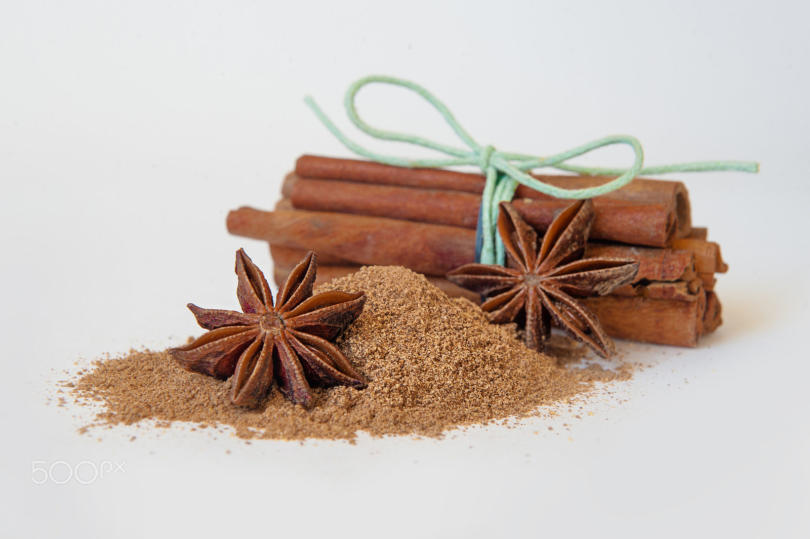 Nikon D700 sample photo. Cinnamon sticks and powder on white background. baking spices photography