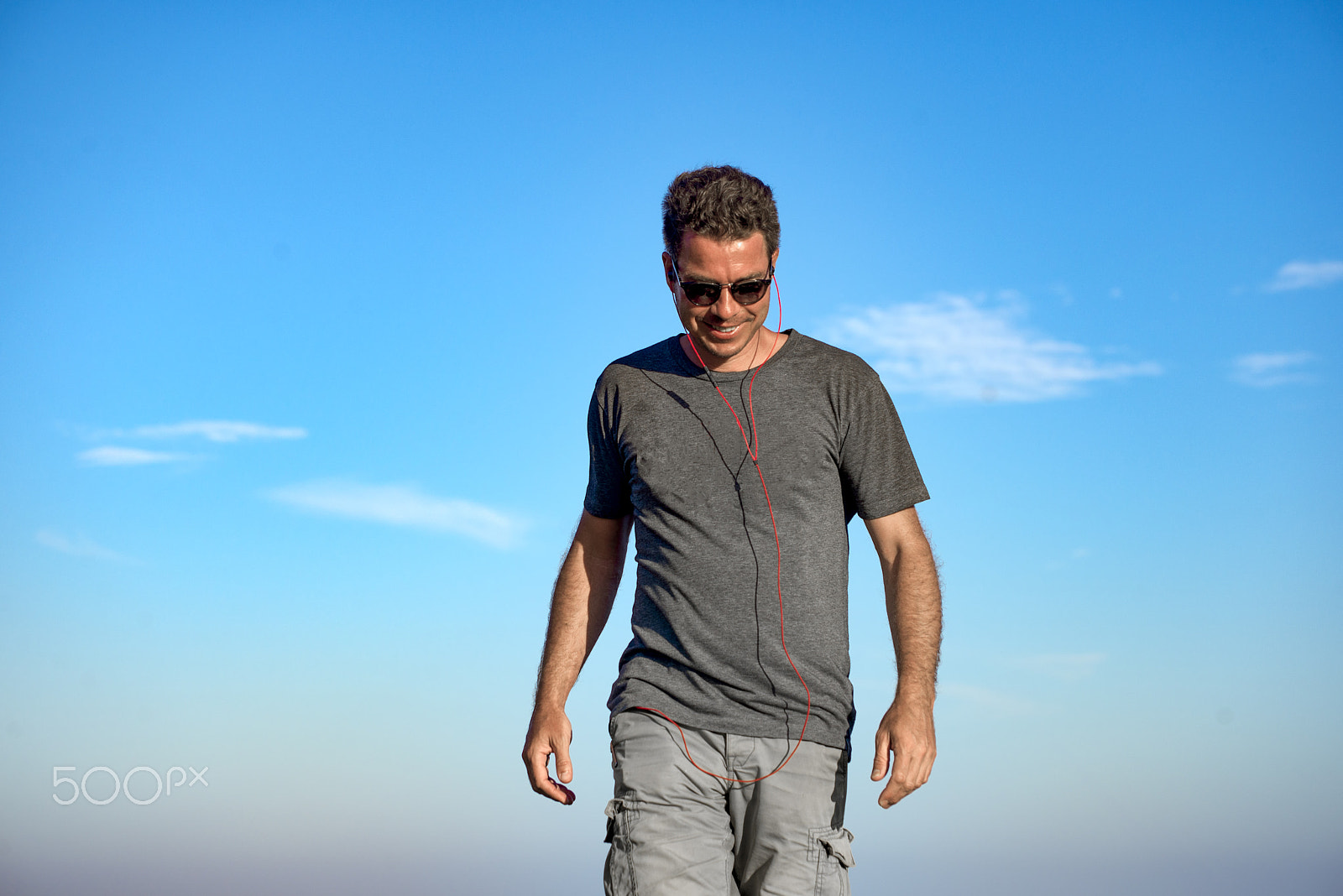 Nikon D600 sample photo. Man listening to music while walking photography