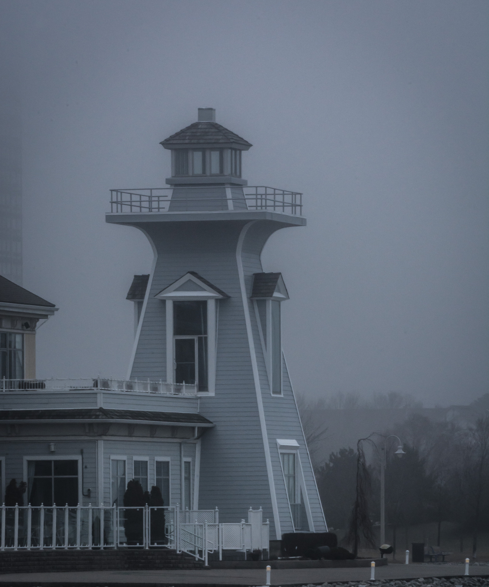 Nikon AF-S Nikkor 200-500mm F5.6E ED VR sample photo. Lighthouse at a foggy harbor photography