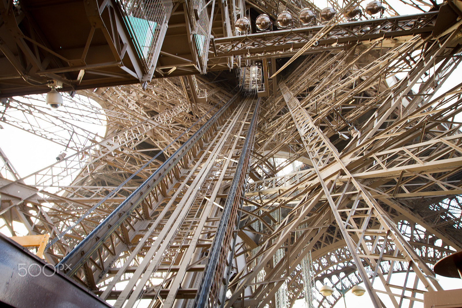 Canon EF 16-35mm F2.8L II USM sample photo. Looking up the interior of the eiffel tower photography