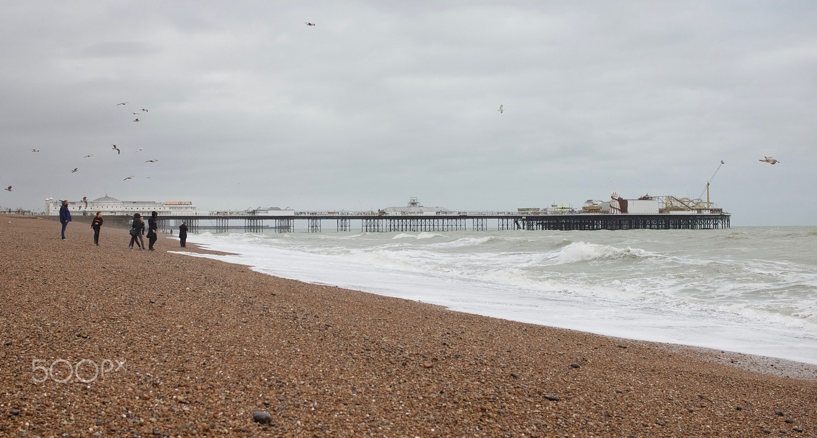Canon EF-S 24mm F2.8 STM sample photo. People_walking_on_brighton_seafront.jpg photography