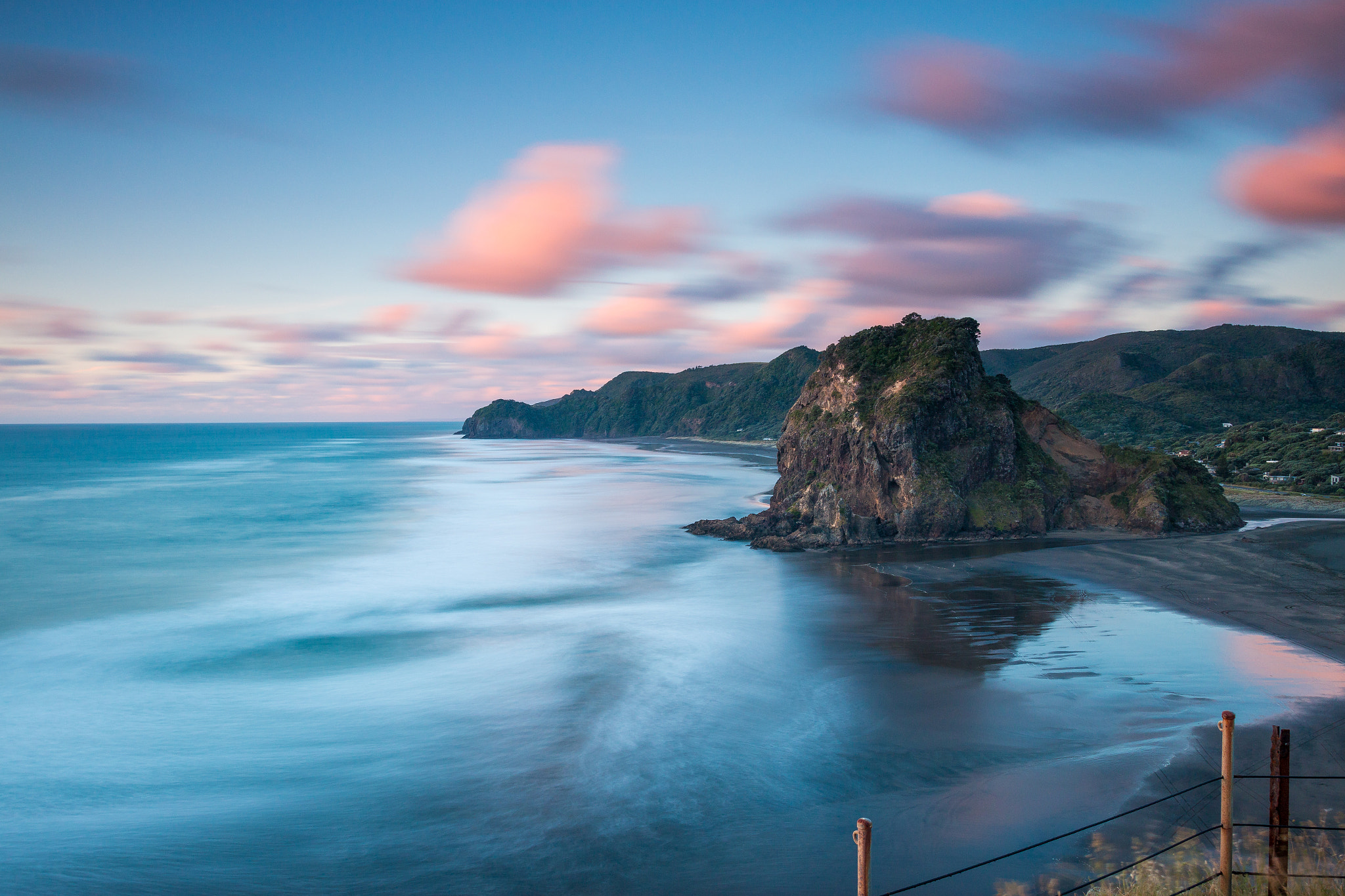 Canon EOS 70D + Sigma 18-35mm f/1.8 DC HSM sample photo. Lion rock, piha beach at sunset photography