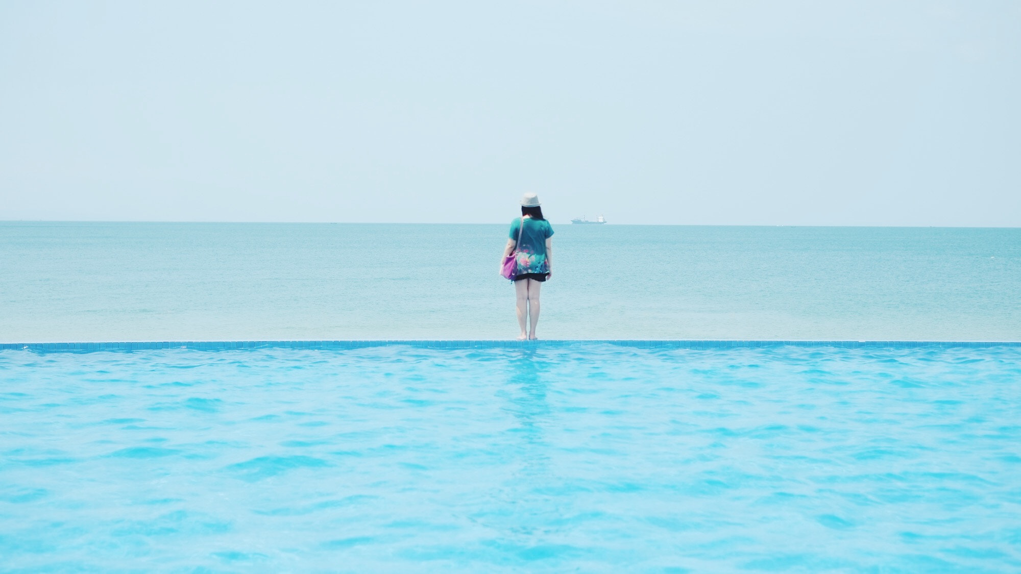 Fujifilm X-Pro1 sample photo. My sister looking at the sea photography