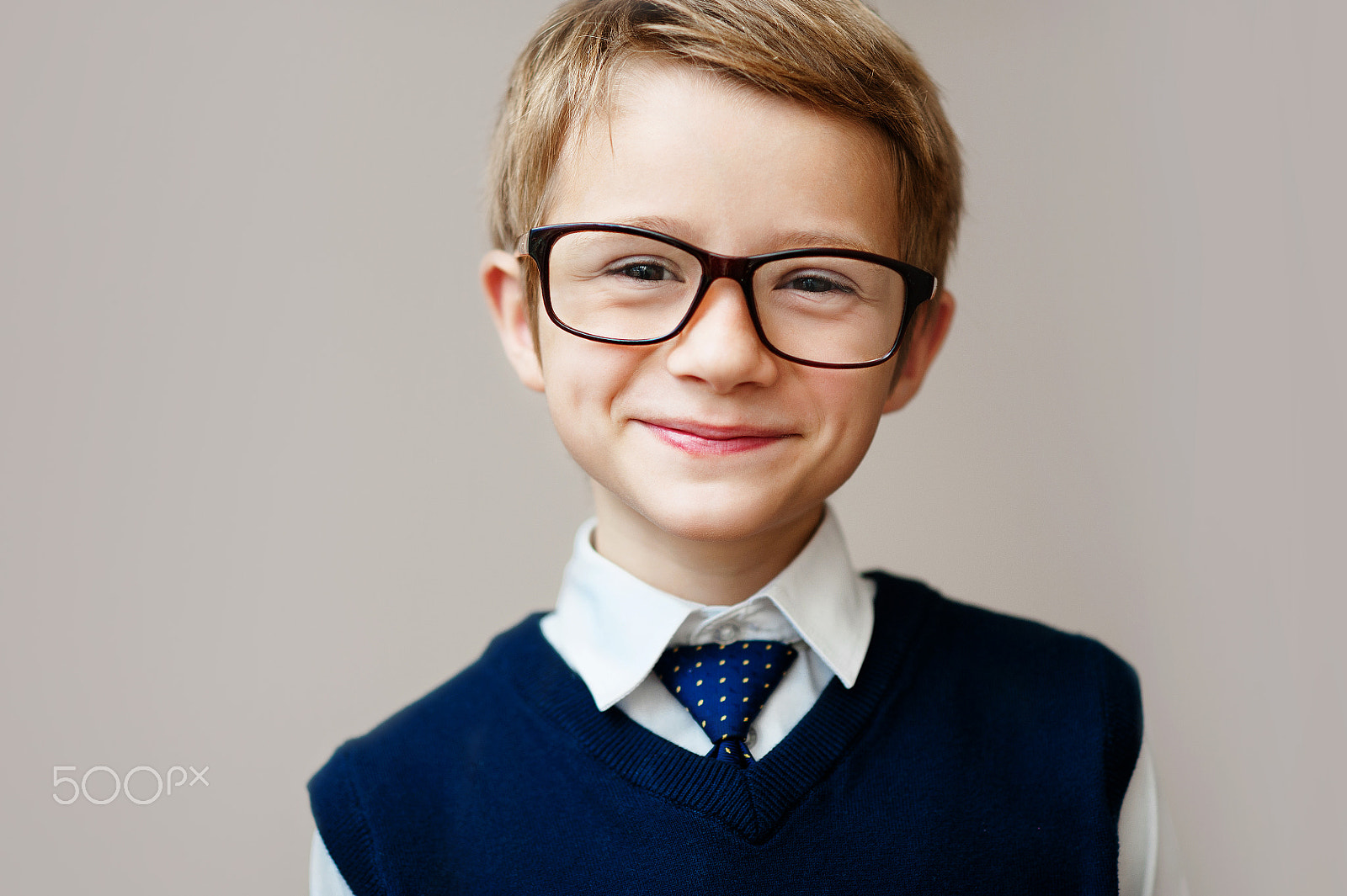 Nikon D700 + Nikon AF Nikkor 85mm F1.8D sample photo. Closeup of little boy in school uniform. happy schoolboy smiling and looking at camera. photography