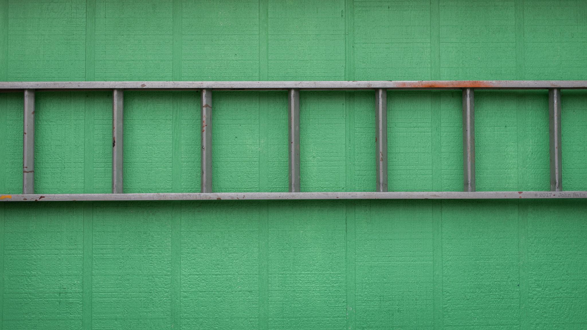 Nikon D610 + Nikon AF Nikkor 50mm F1.4D sample photo. Ladder on a green wall photography