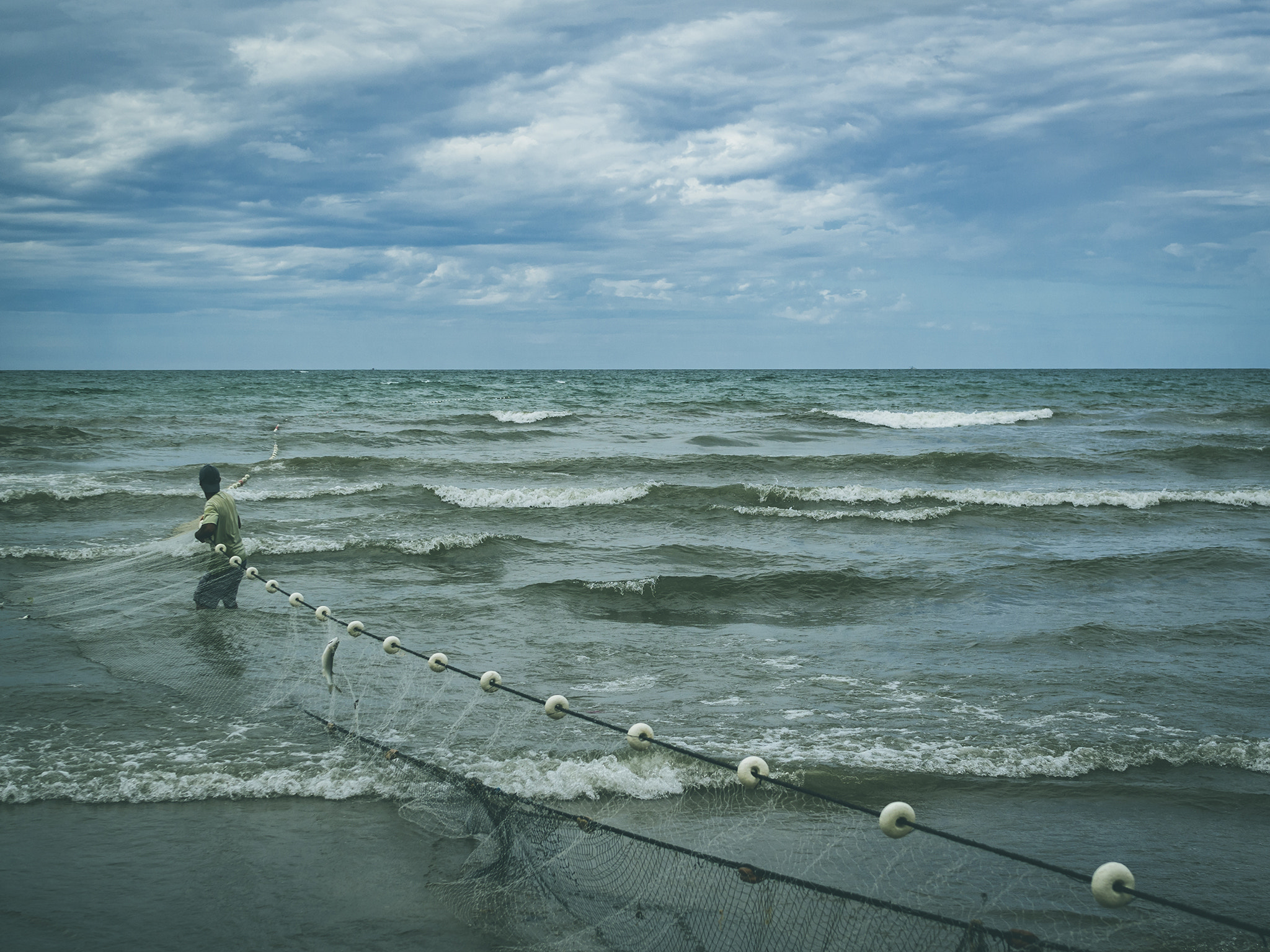 Sigma 30mm F2.8 DN Art sample photo. A man against the sea. photography