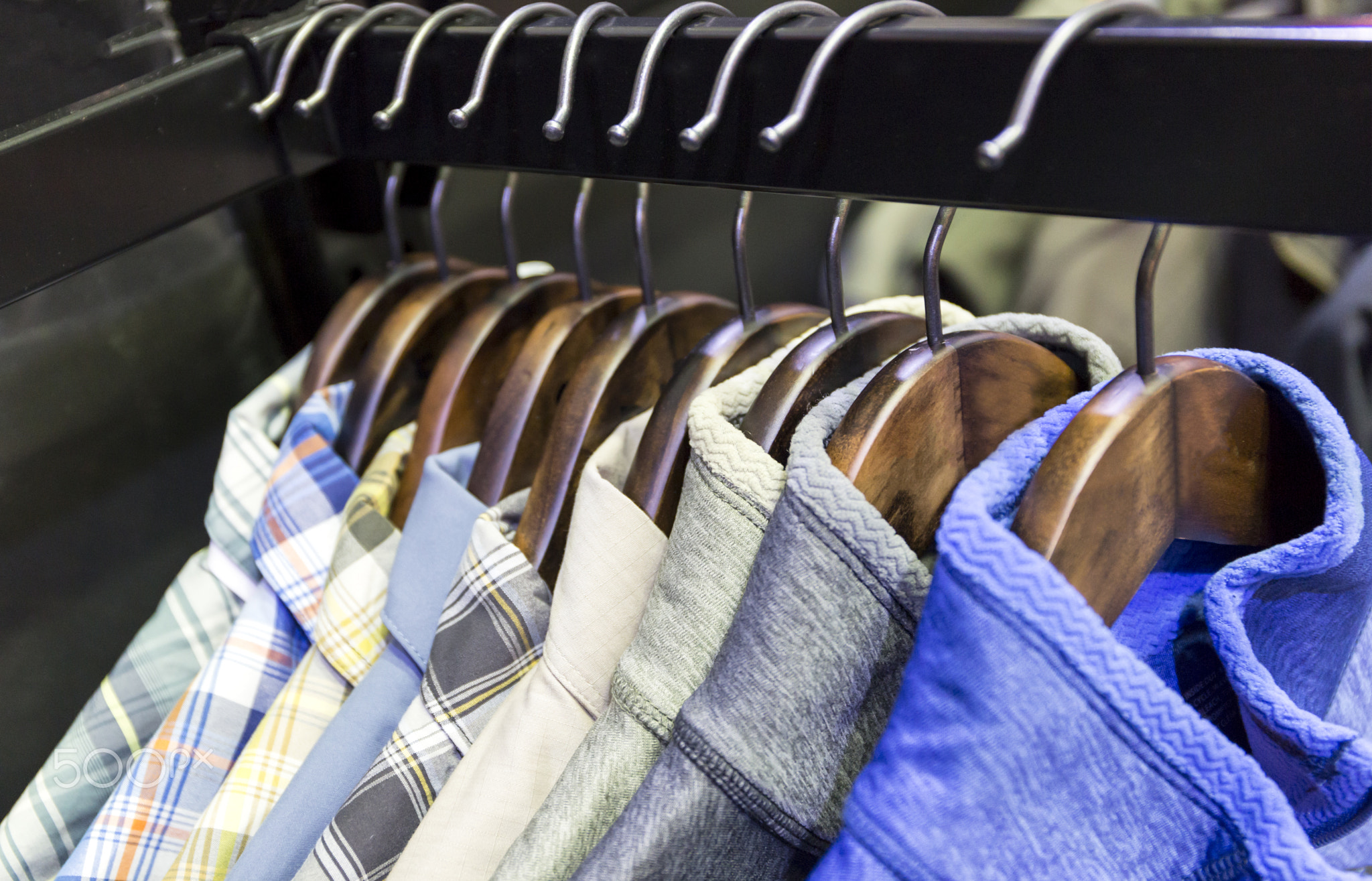 Clothes hang on a shelf in a designer clothes store in Melbourne, Australia