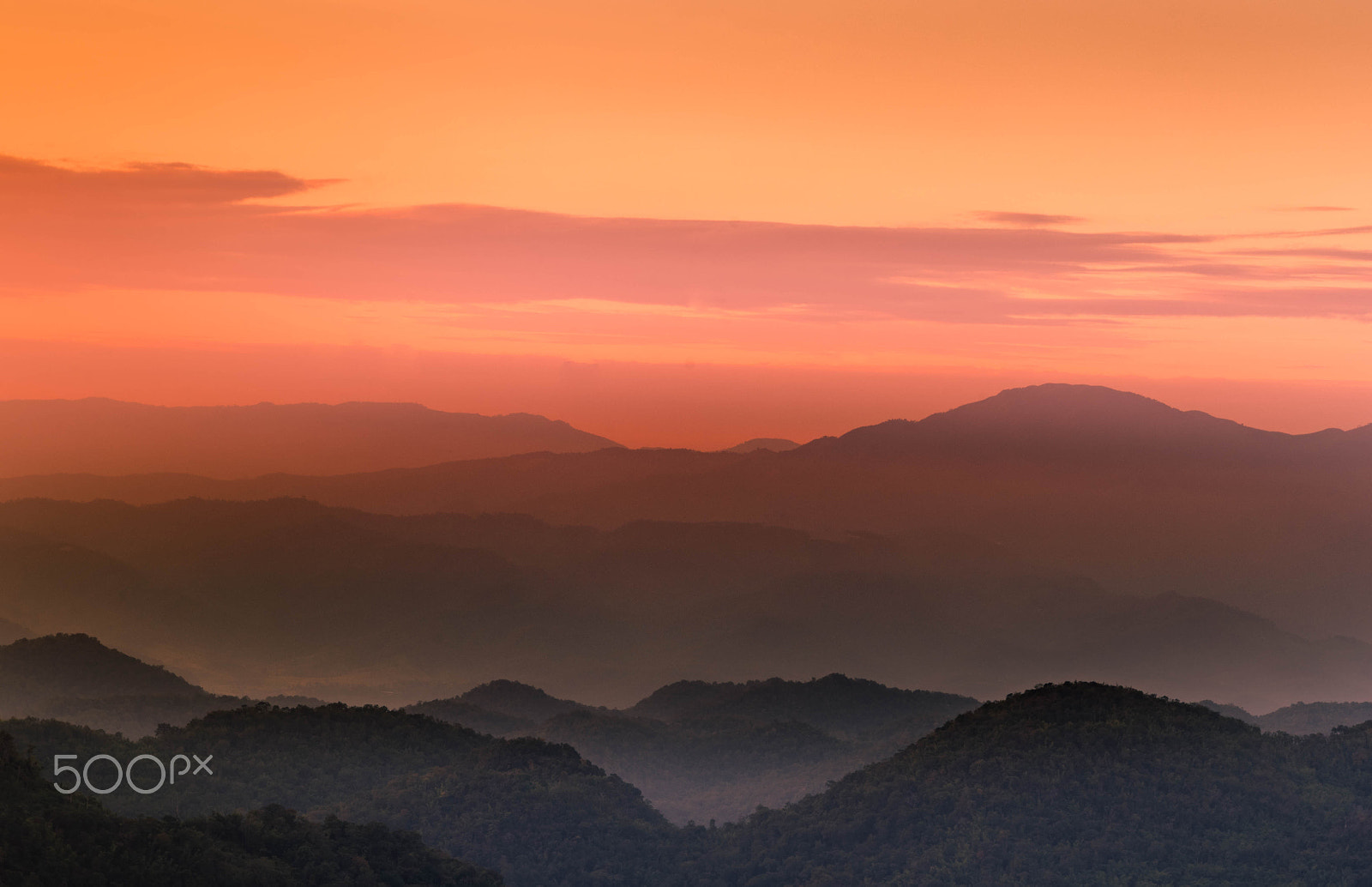 Nikon D7000 + Nikon AF-S DX Nikkor 18-135mm F3.5-5.6G ED-IF sample photo. Orange and pink twilight  sunset with layers of mountains silhou photography