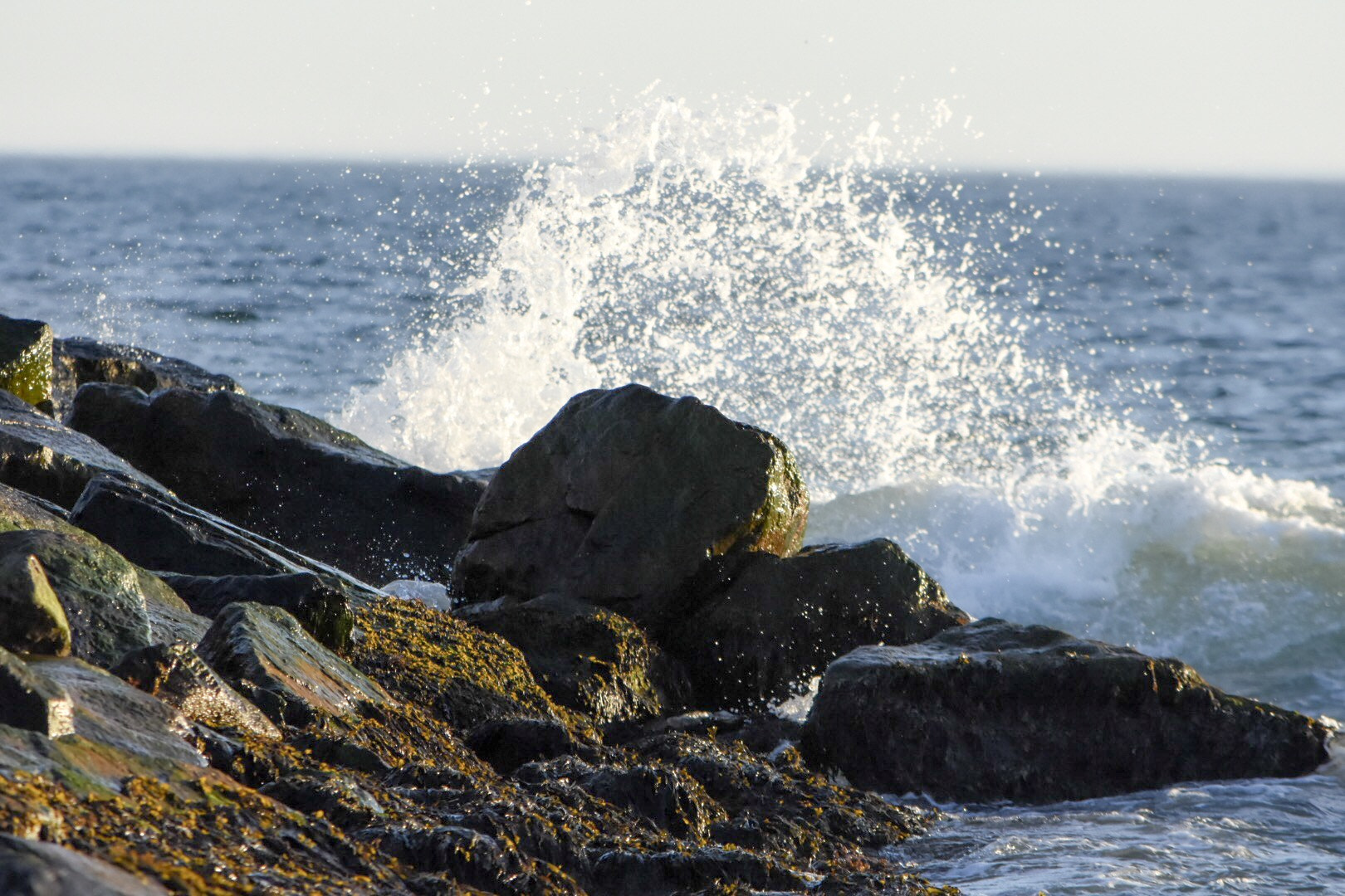 Nikon AF-S DX Nikkor 55-300mm F4.5-5.6G ED VR sample photo. Water crashing on rocks photography