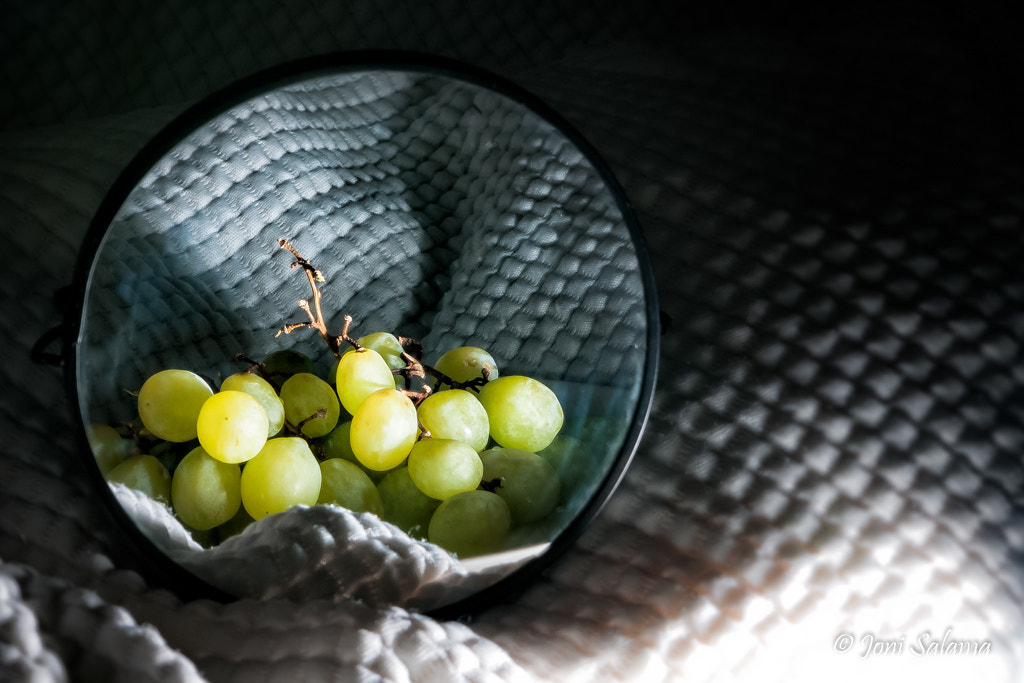 Sony Alpha DSLR-A700 sample photo. Grapes on a mirror photography