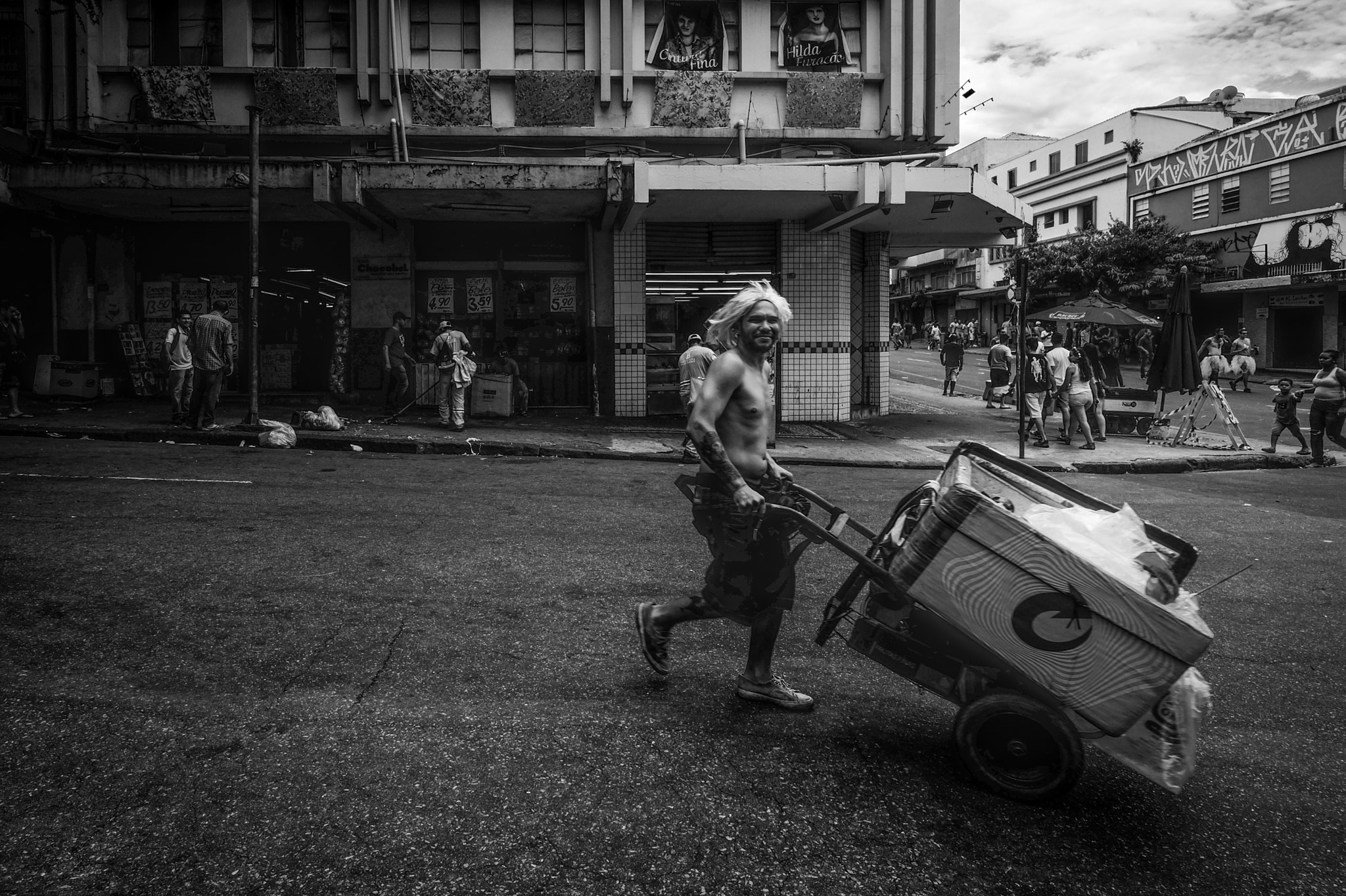 ZEISS Touit 12mm F2.8 sample photo. A street vendor in carnival photography