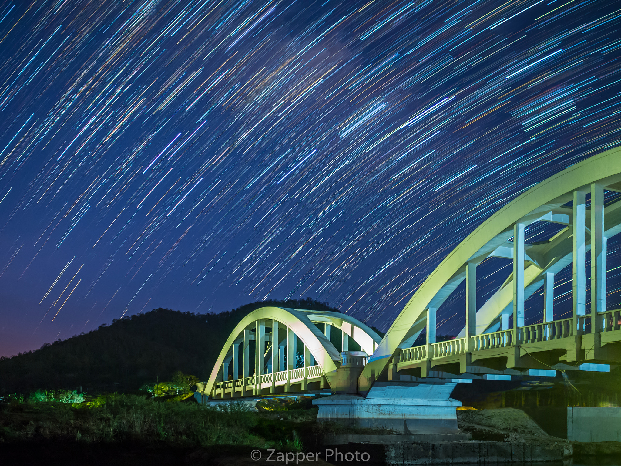 Olympus OM-D E-M10 II + Olympus M.Zuiko Digital 17mm F1.8 sample photo. Startrails across over the bridge. photography