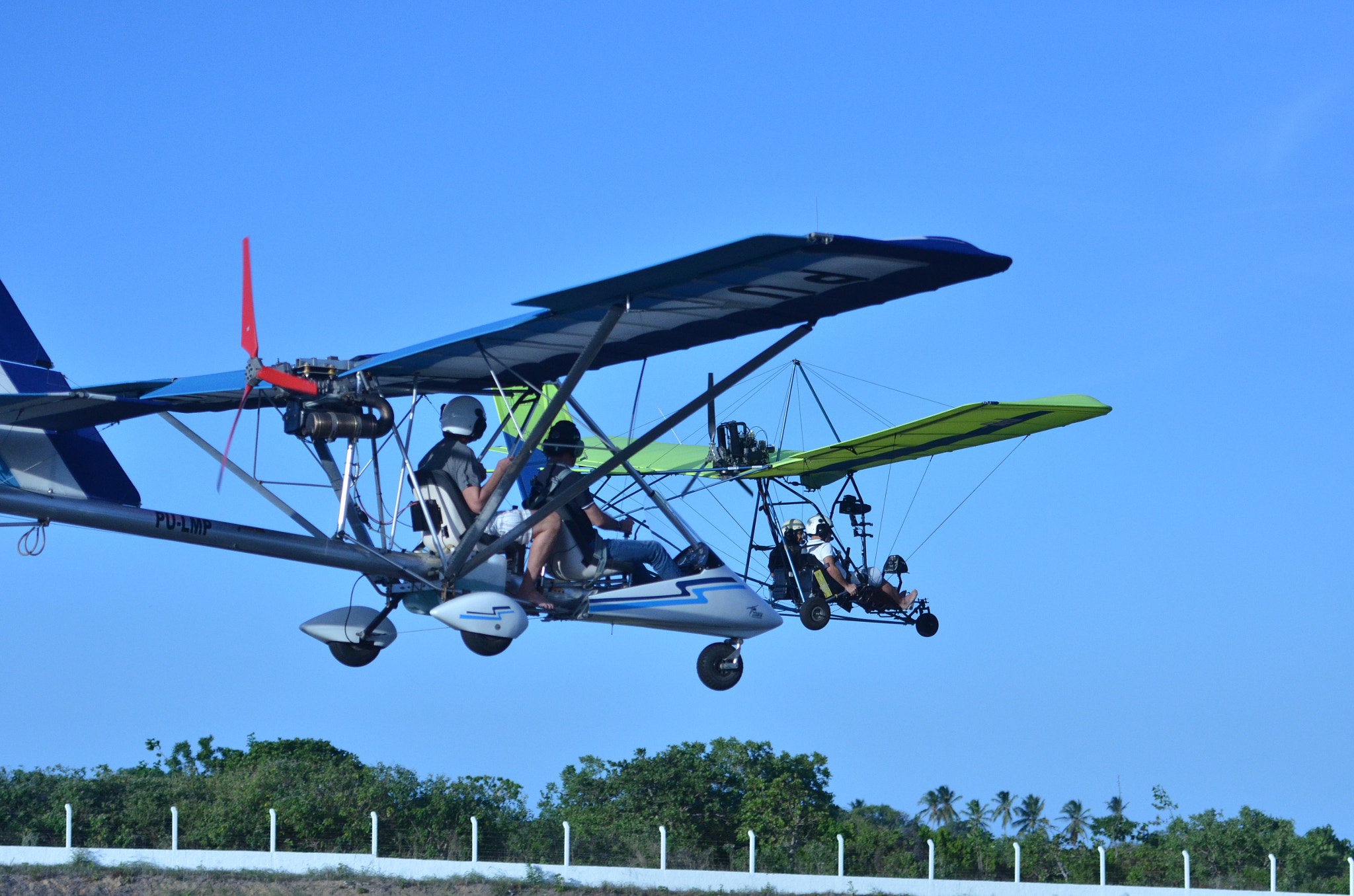 Nikon D7000 sample photo. Double formation flyby microlight flight over runway... photography