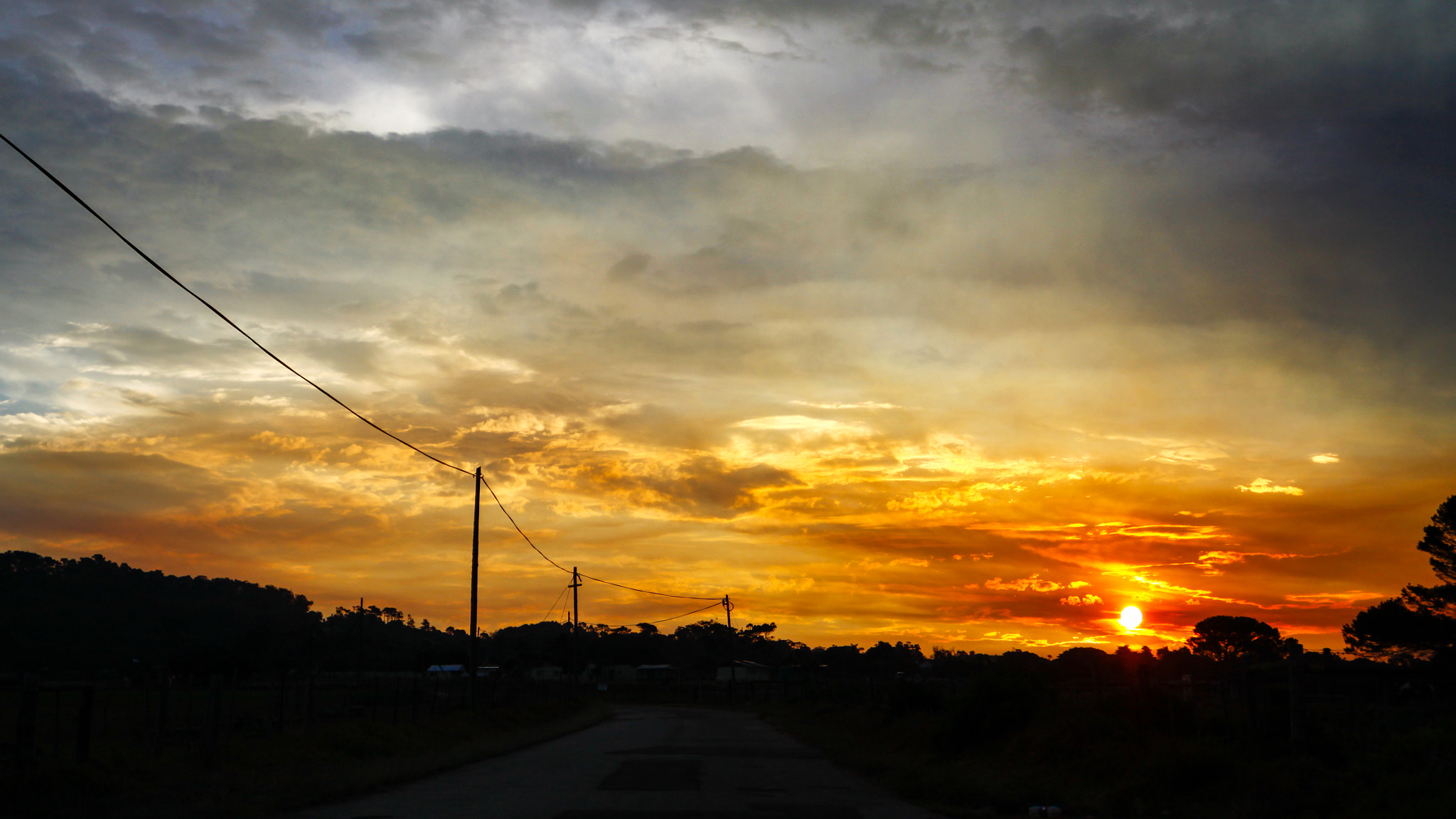 Canon EOS 50D + Canon EF 300mm f/2.8L sample photo. Yellow and orange sunset on the road trip photography