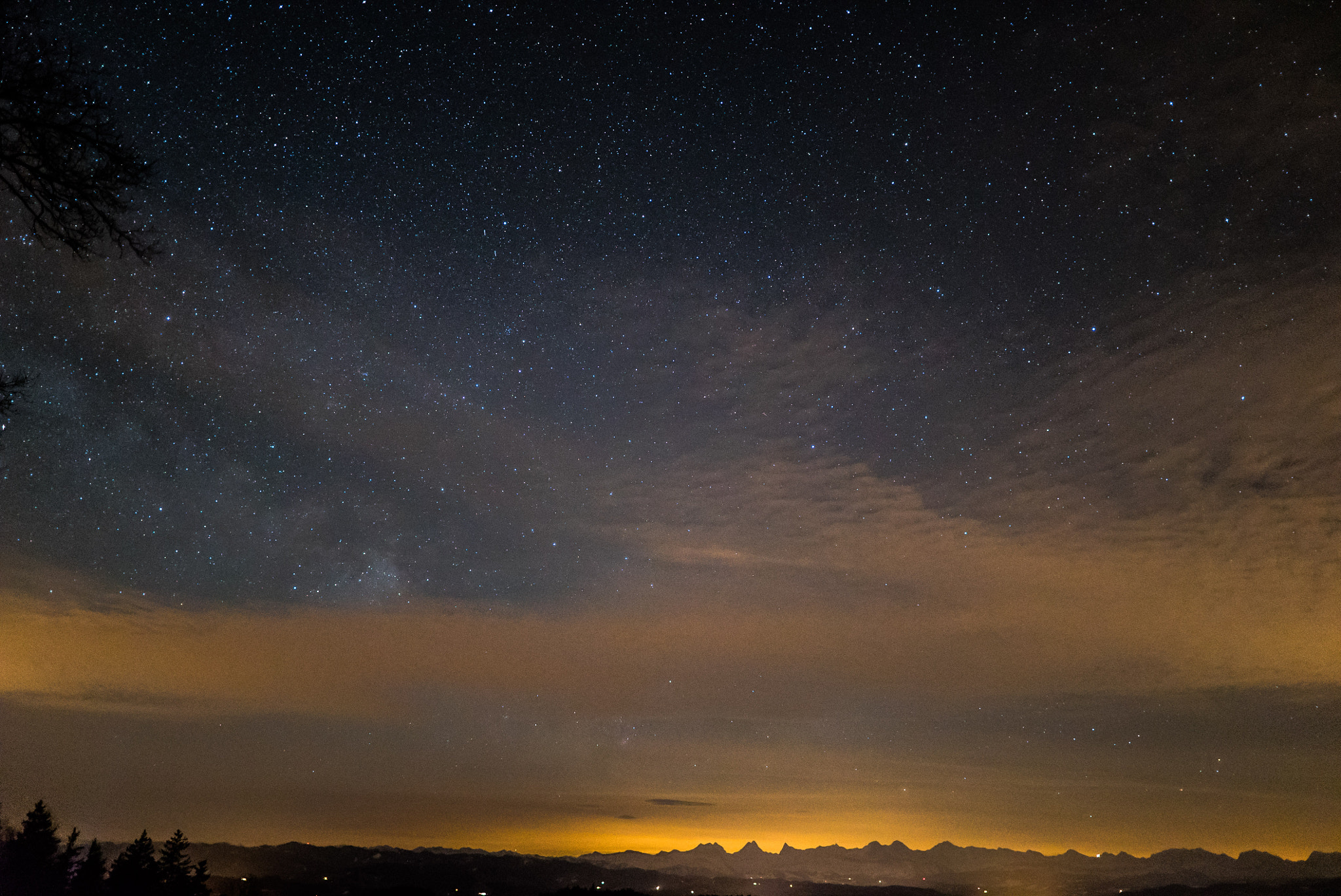 E 20mm F1.4 sample photo. A small piece of the milkyway - covered by clouds and the alps photography