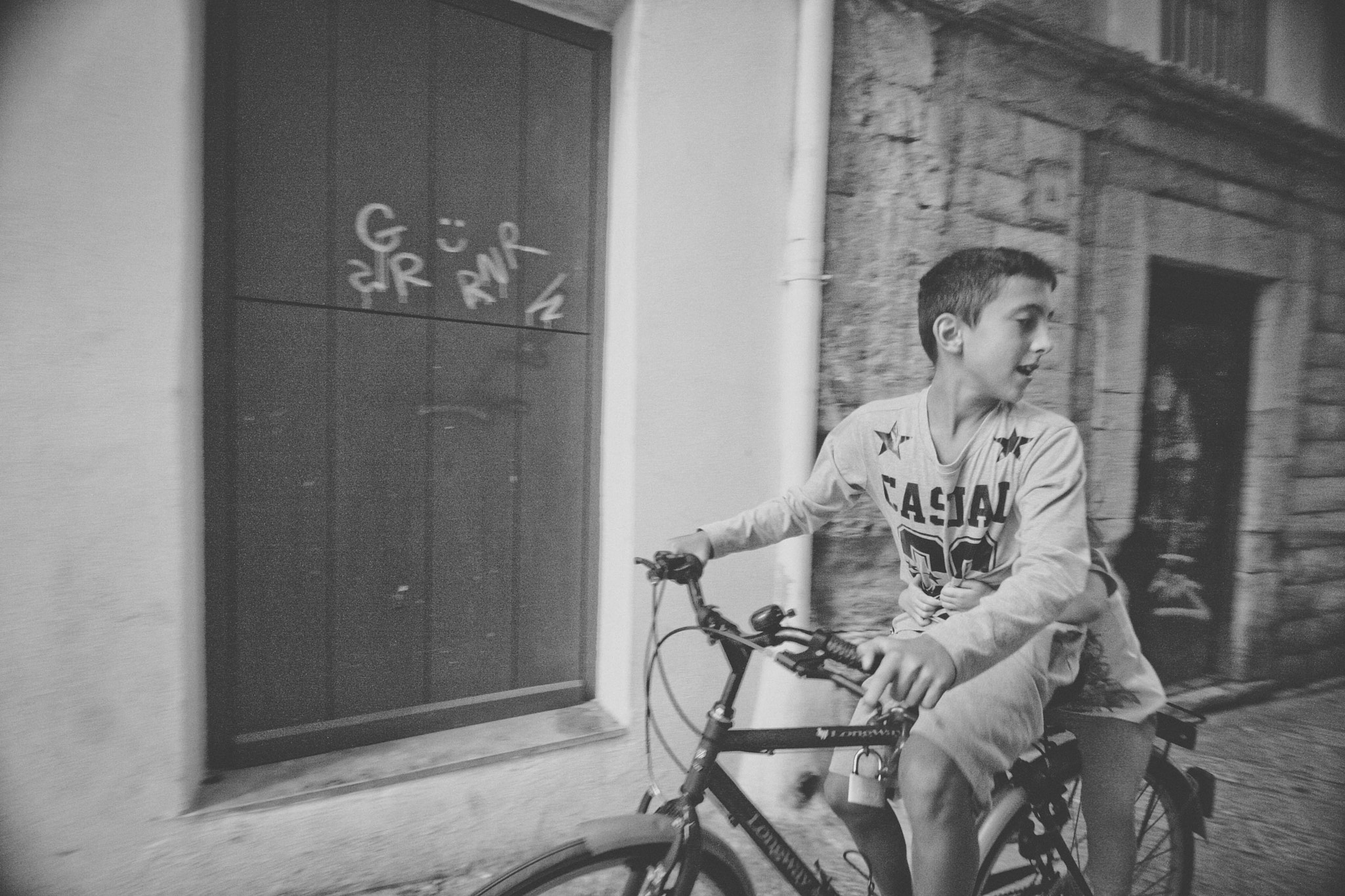 Sigma 10-20mm F3.5 EX DC HSM sample photo. Kids on a bike photography