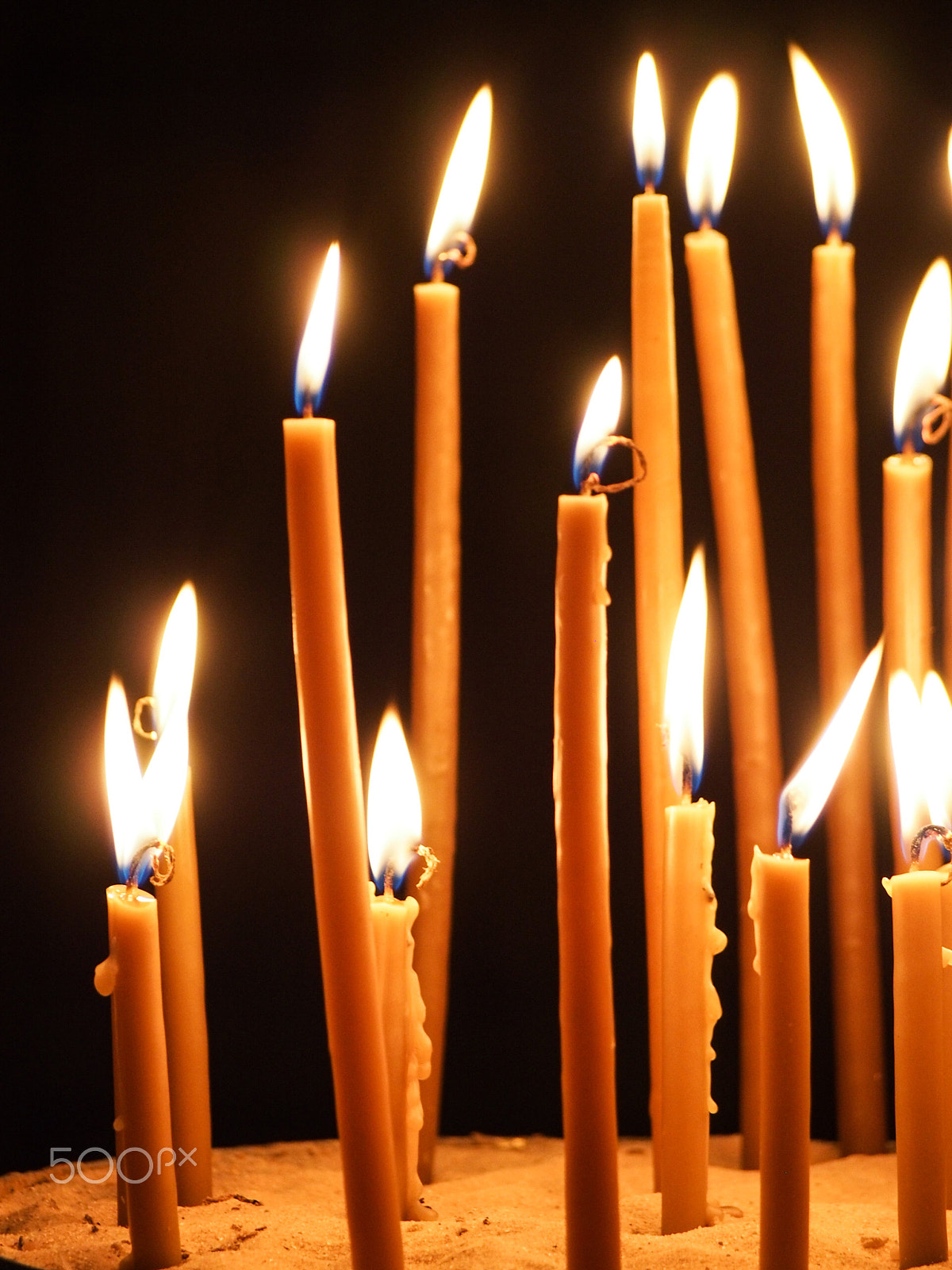 Olympus OM-D E-M5 sample photo. Prayer candles burning photography
