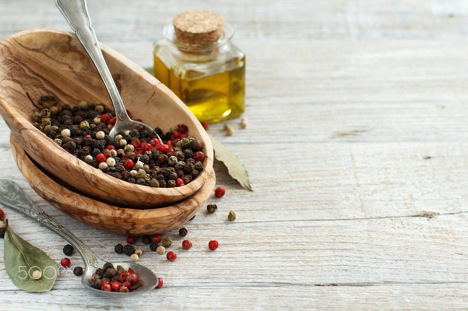 Canon EOS 650D (EOS Rebel T4i / EOS Kiss X6i) + Canon EF 50mm F1.2L USM sample photo. Peppercorn mix in a bowl, bay leaves  and olive oil photography