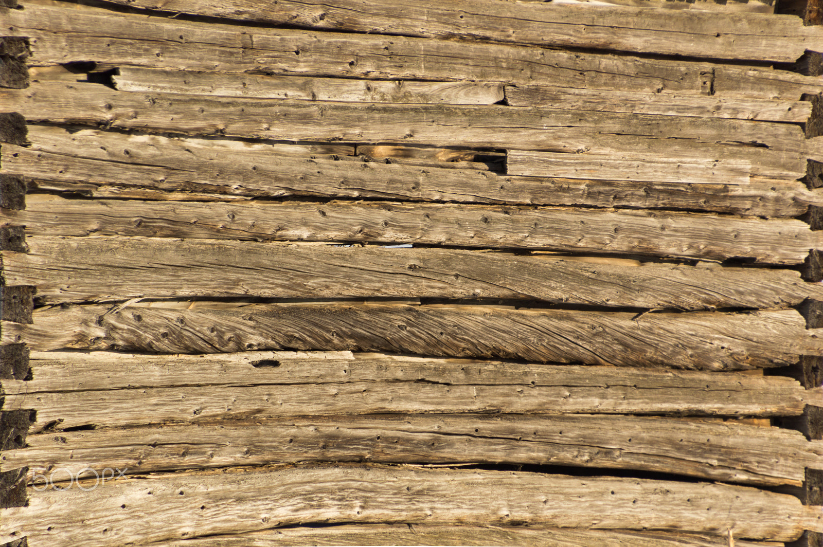 Nikon D3200 sample photo. Background pioneer log cabin barn wall in sunshine photography