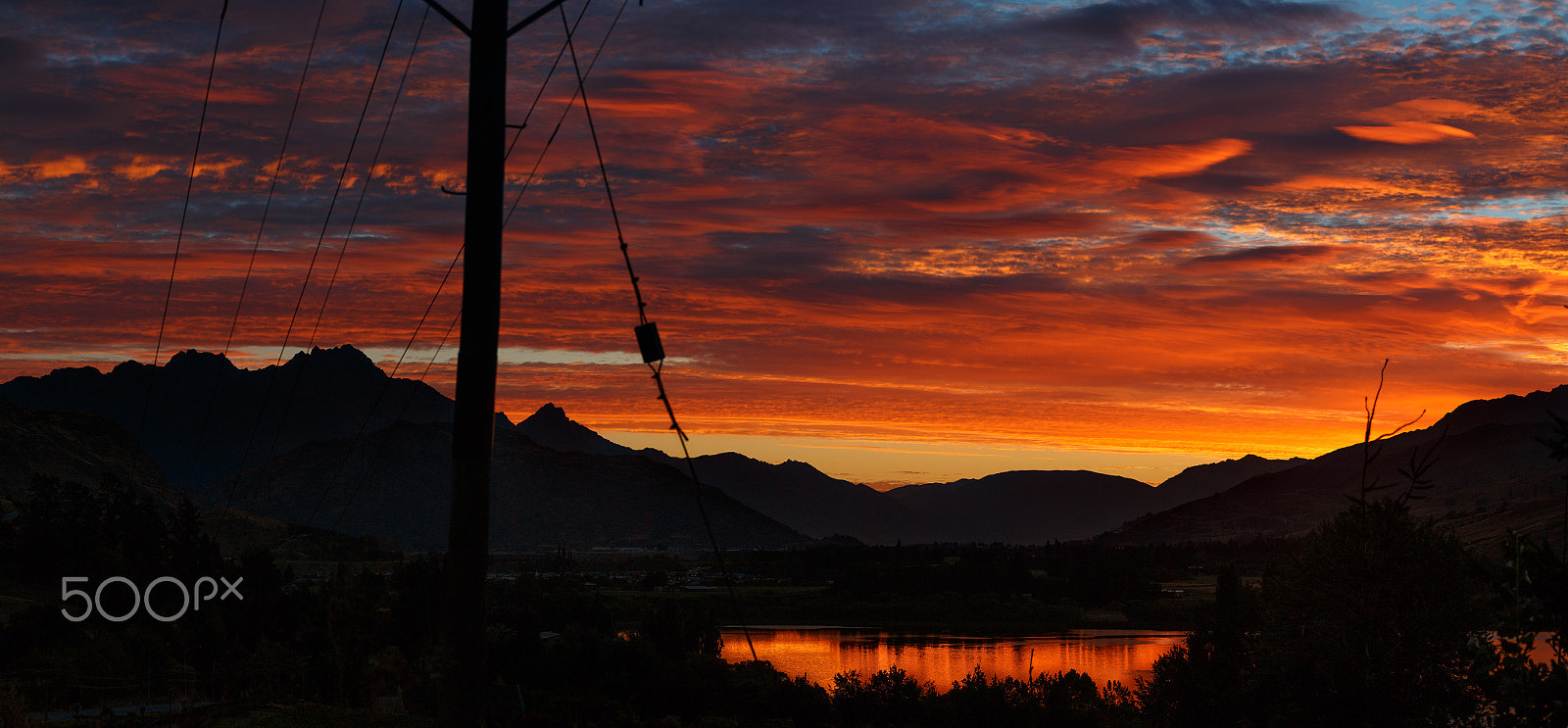 Canon EOS 70D + Canon EF 70-200mm F4L USM sample photo. Fire in the sky at sunset in lake hayes queenstown photography